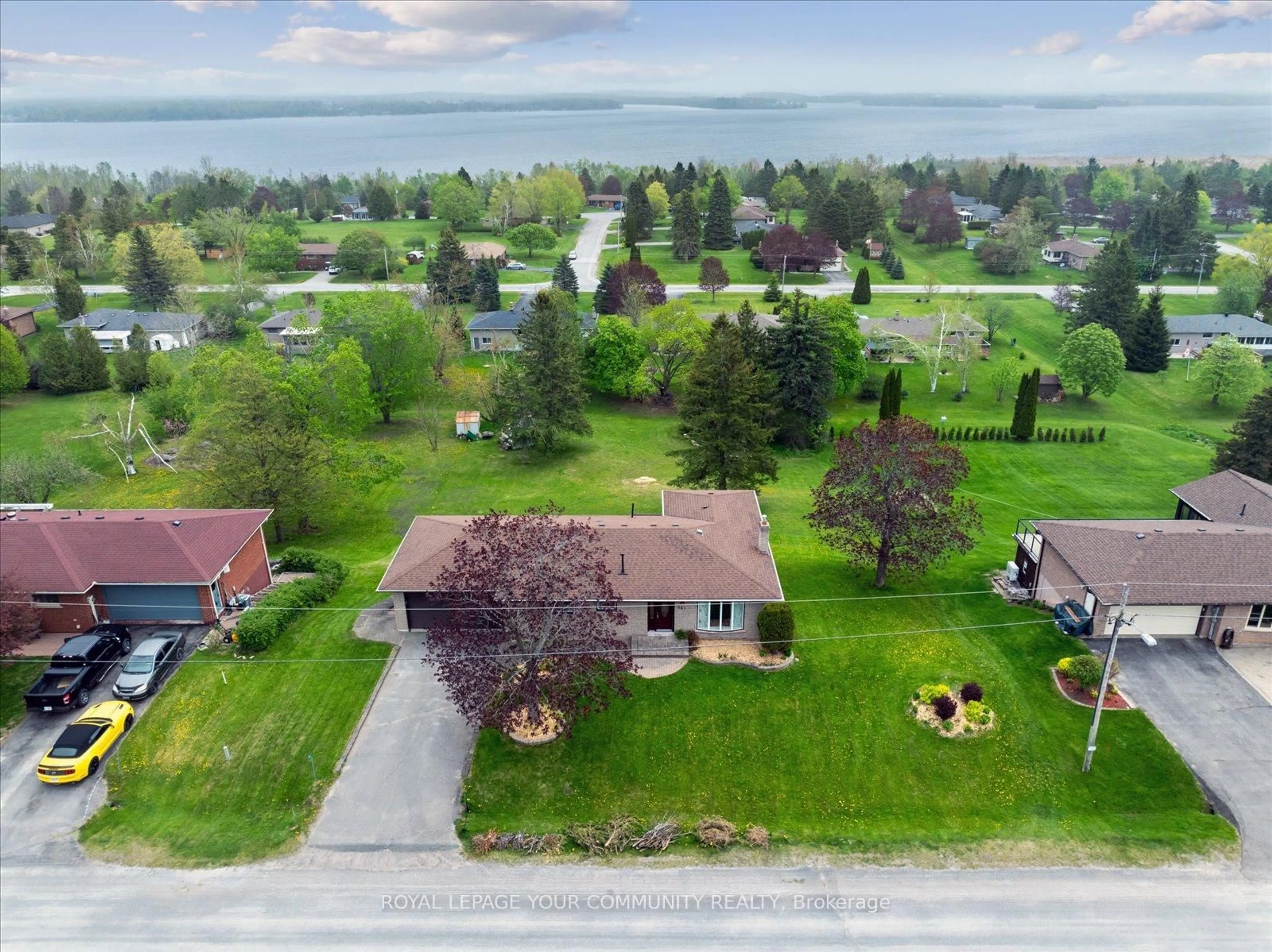 A pic from outside/outdoor area/front of a property/back of a property/a pic from drone, water/lake/river/ocean view for 381 Country Club Circ, Kawartha Lakes Ontario K0M 1A0
