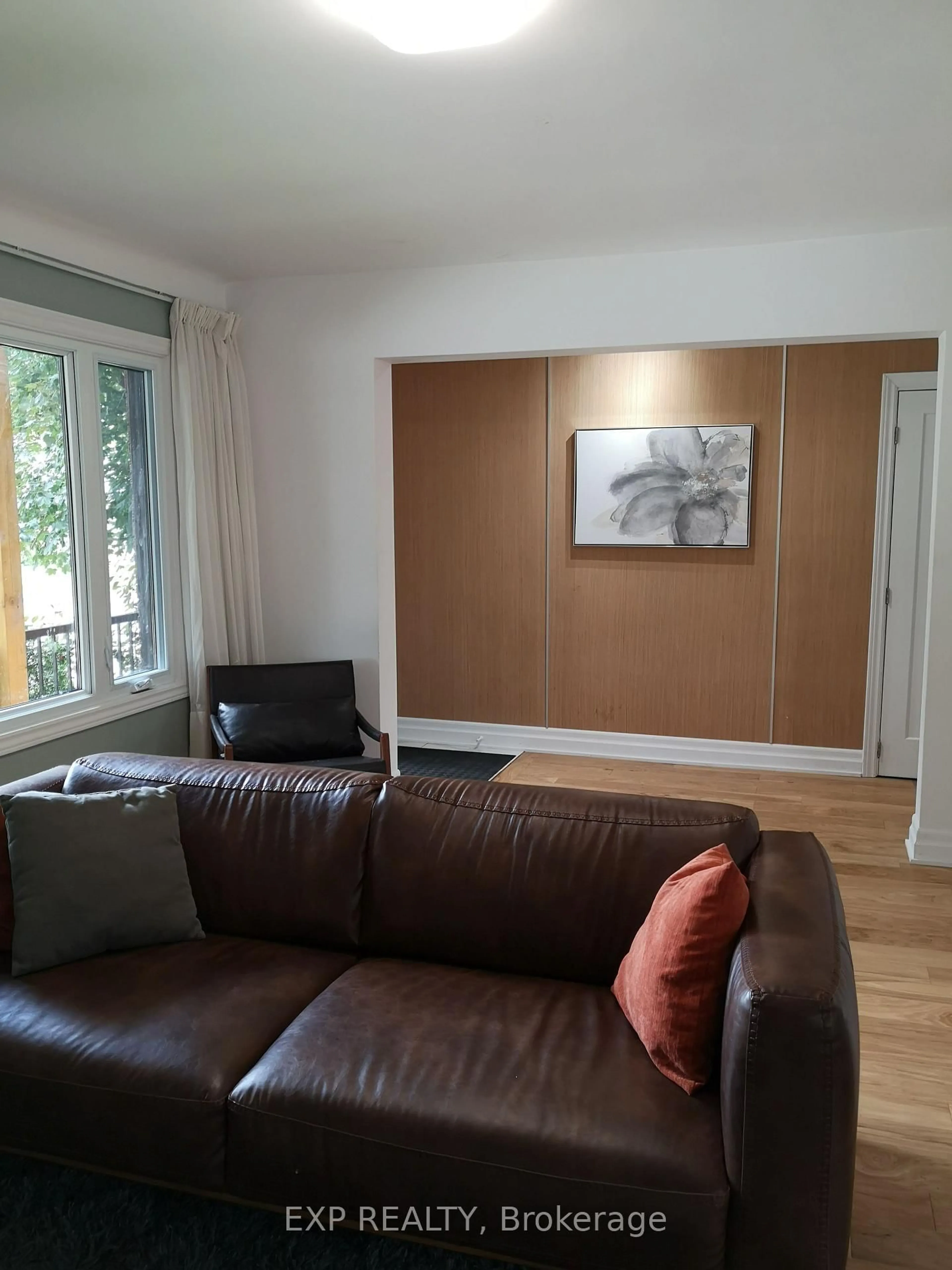 Living room with furniture, wood/laminate floor for 366 Maria Goretti Circ, Ottawa Ontario K1L 7K8