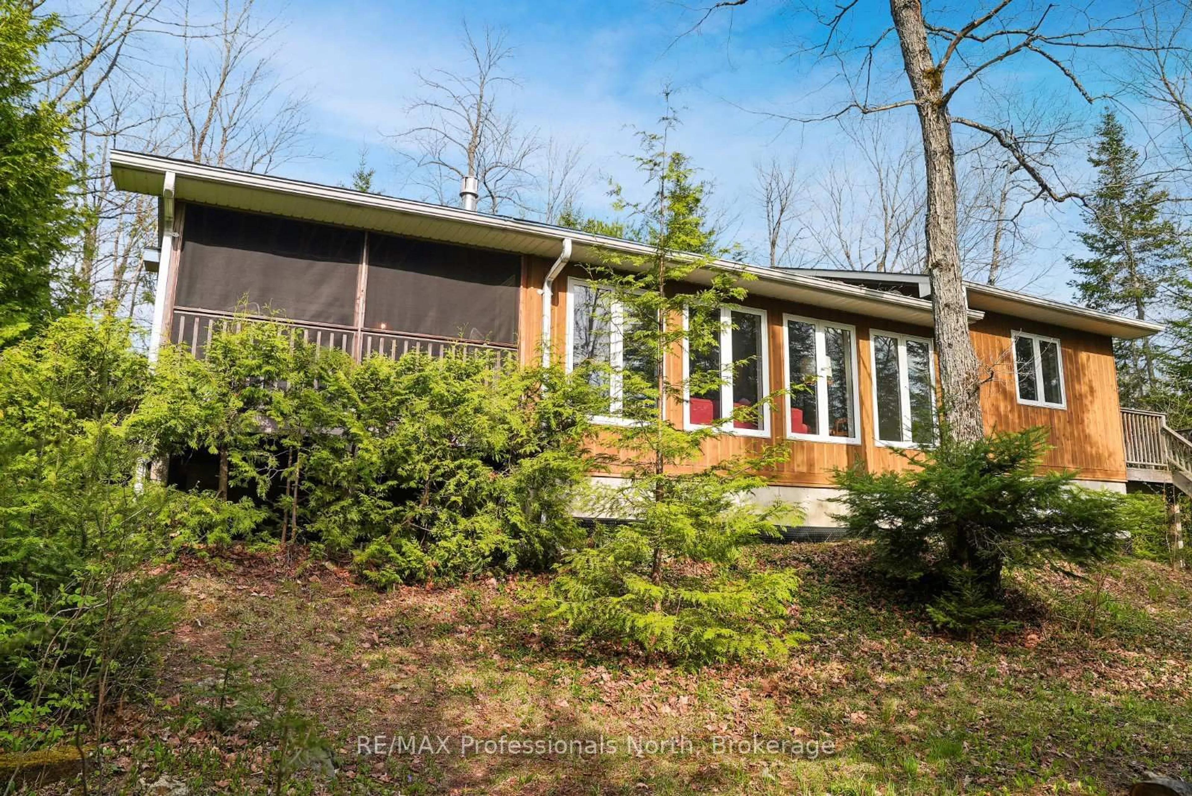 Home with vinyl exterior material, forest/trees view for 1073 Driftwood Bay Dr, Highlands East Ontario K0L 2Y0