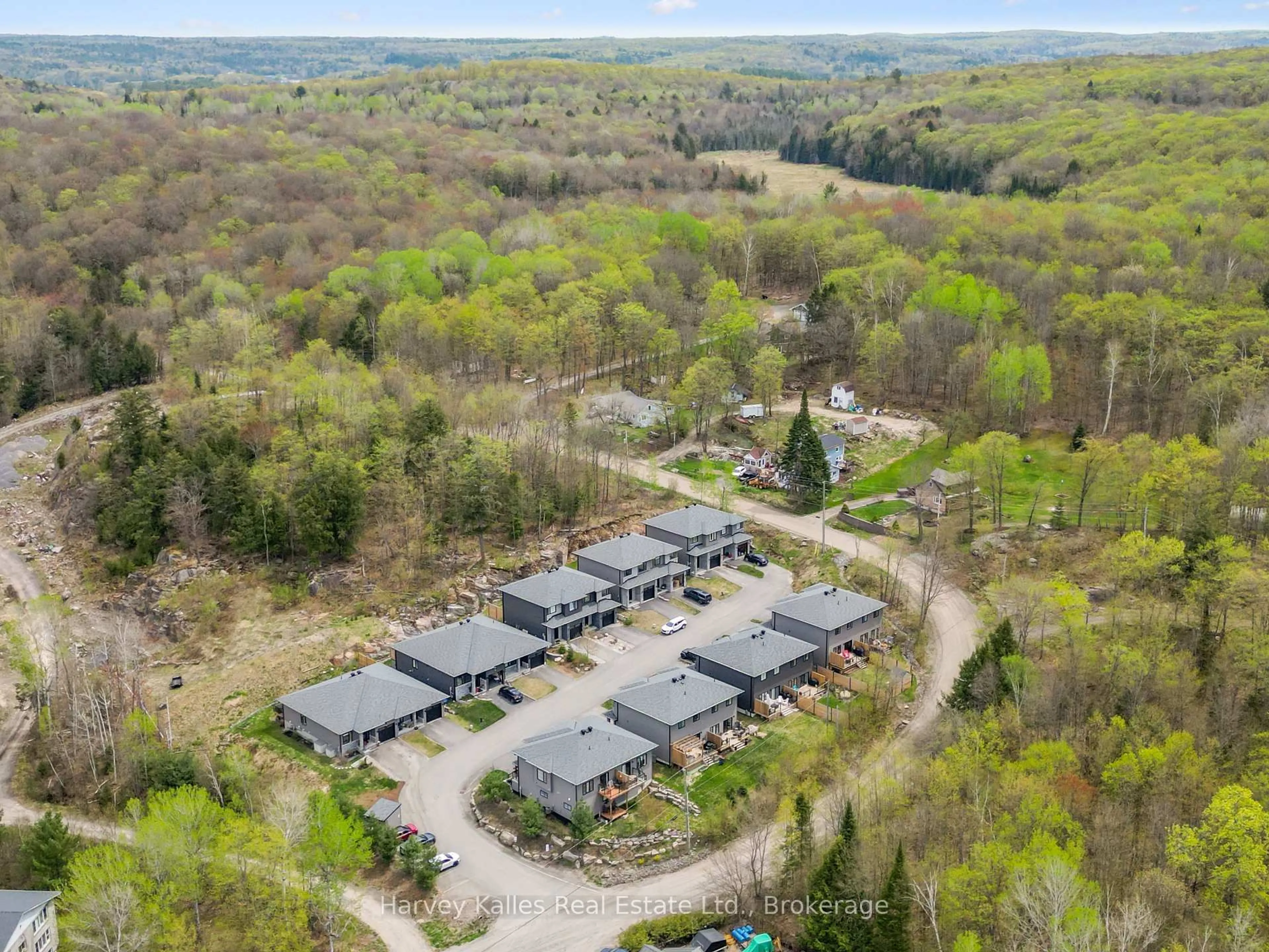 A pic from outside/outdoor area/front of a property/back of a property/a pic from drone, forest/trees view for 9 Cascade Lane, Huntsville Ontario P1H 1Y3