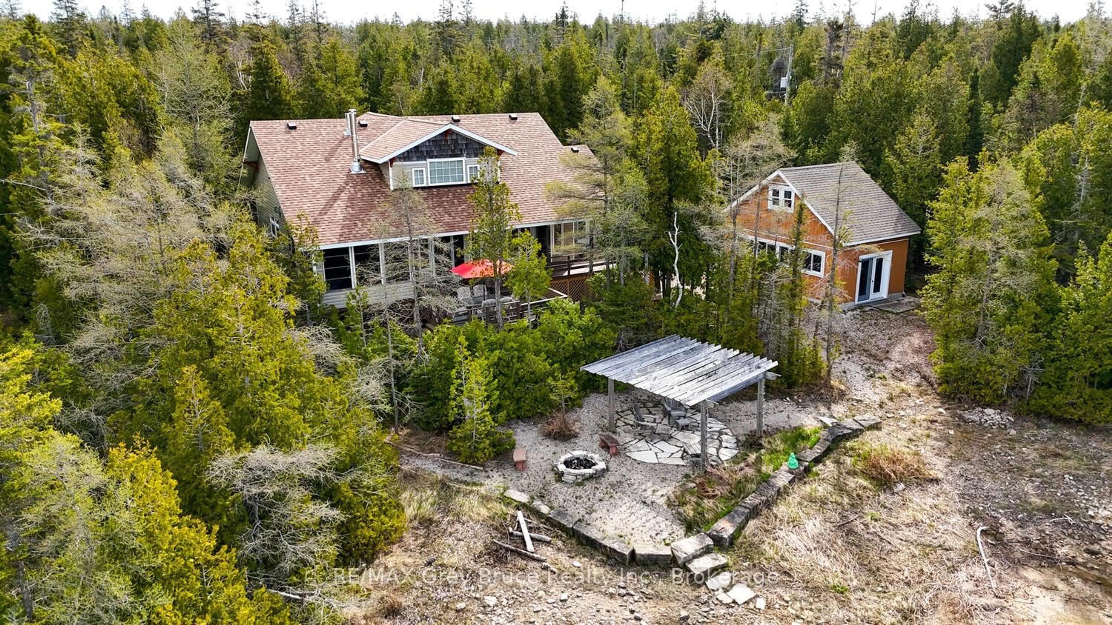 A pic from outside/outdoor area/front of a property/back of a property/a pic from drone, forest/trees view for 205 Eagle Rd, Northern Bruce Peninsula Ontario N0H 2R0