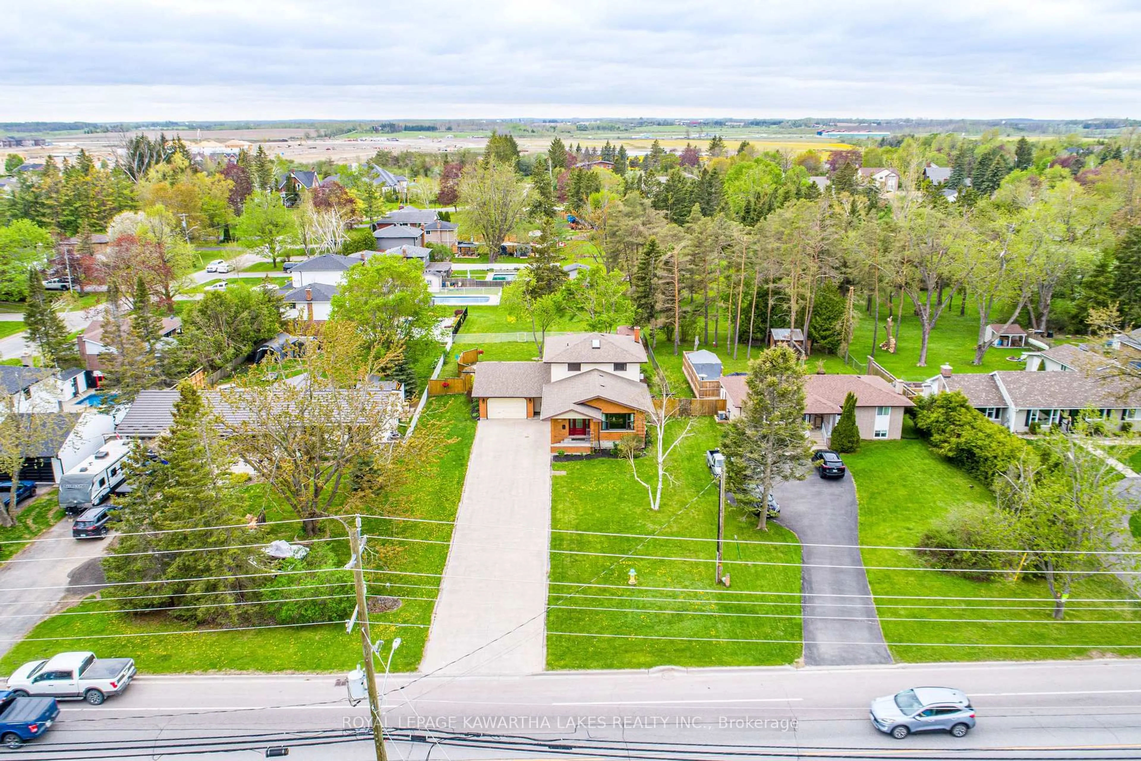 A pic from outside/outdoor area/front of a property/back of a property/a pic from drone, street for 197 Angeline St, Kawartha Lakes Ontario K9V 4Y5