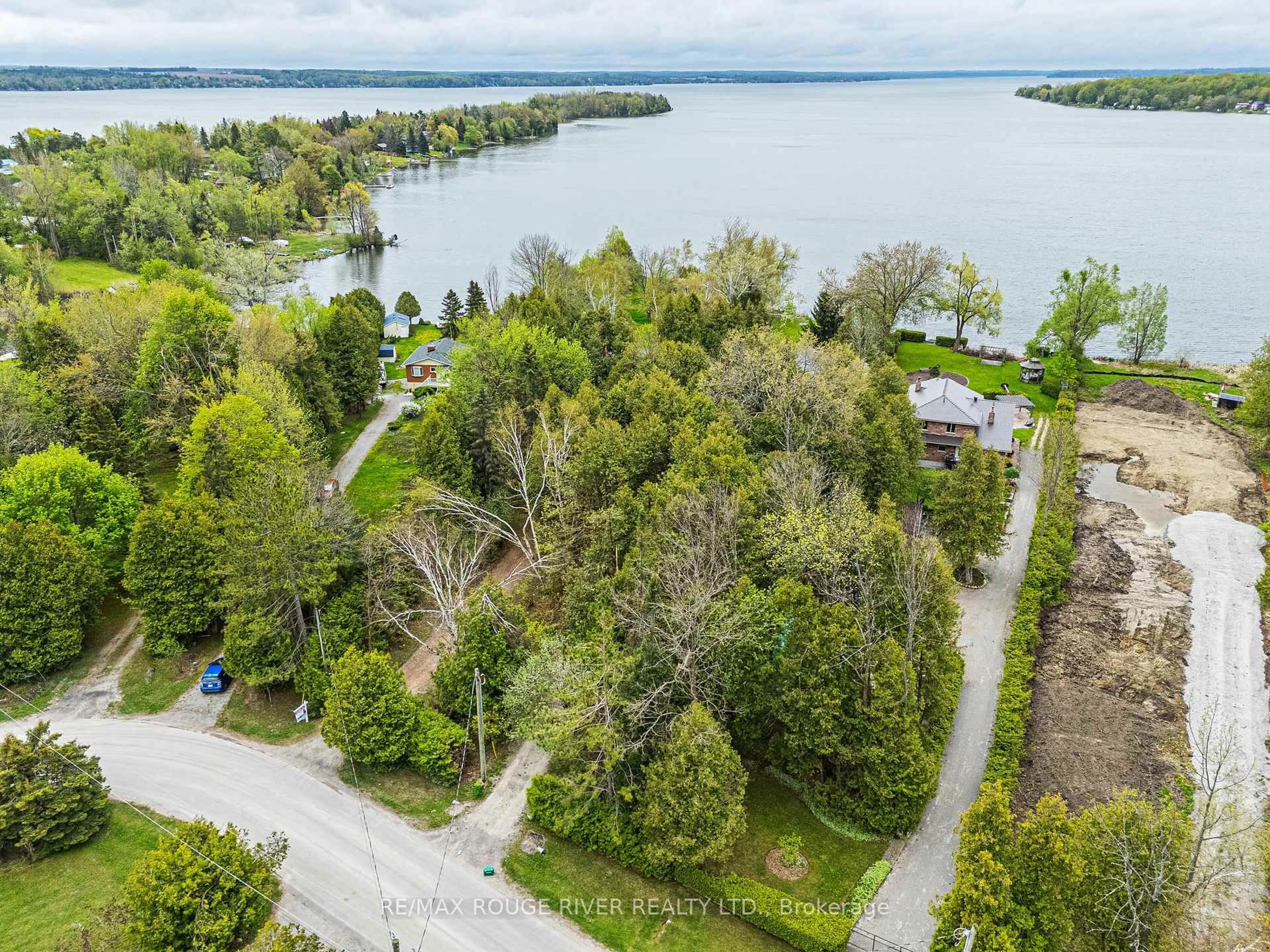 A pic from outside/outdoor area/front of a property/back of a property/a pic from drone, water/lake/river/ocean view for 25 Oakdene Cres, Kawartha Lakes Ontario K0M 2C0