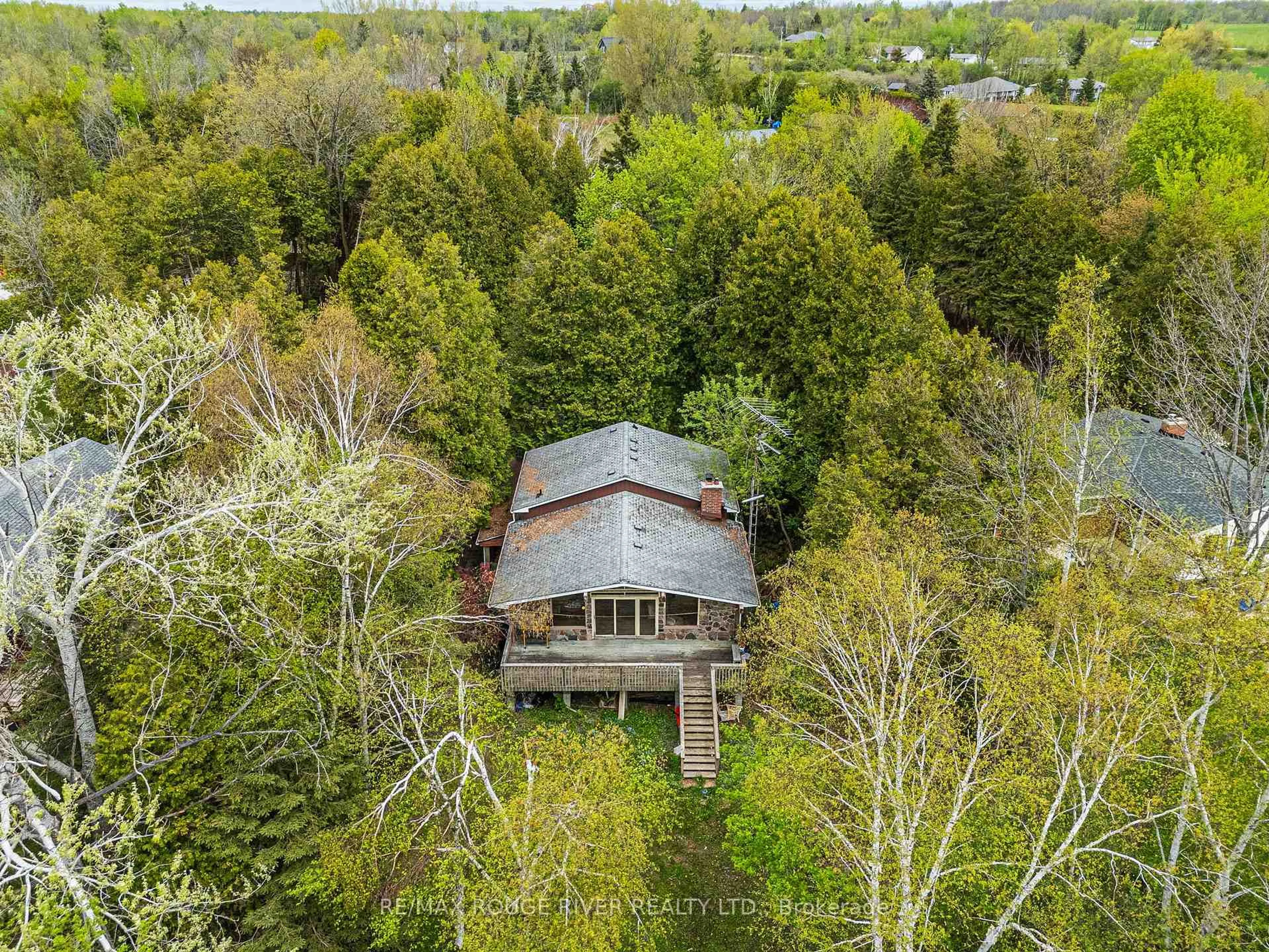 A pic from outside/outdoor area/front of a property/back of a property/a pic from drone, forest/trees view for 25 Oakdene Cres, Kawartha Lakes Ontario K0M 2C0