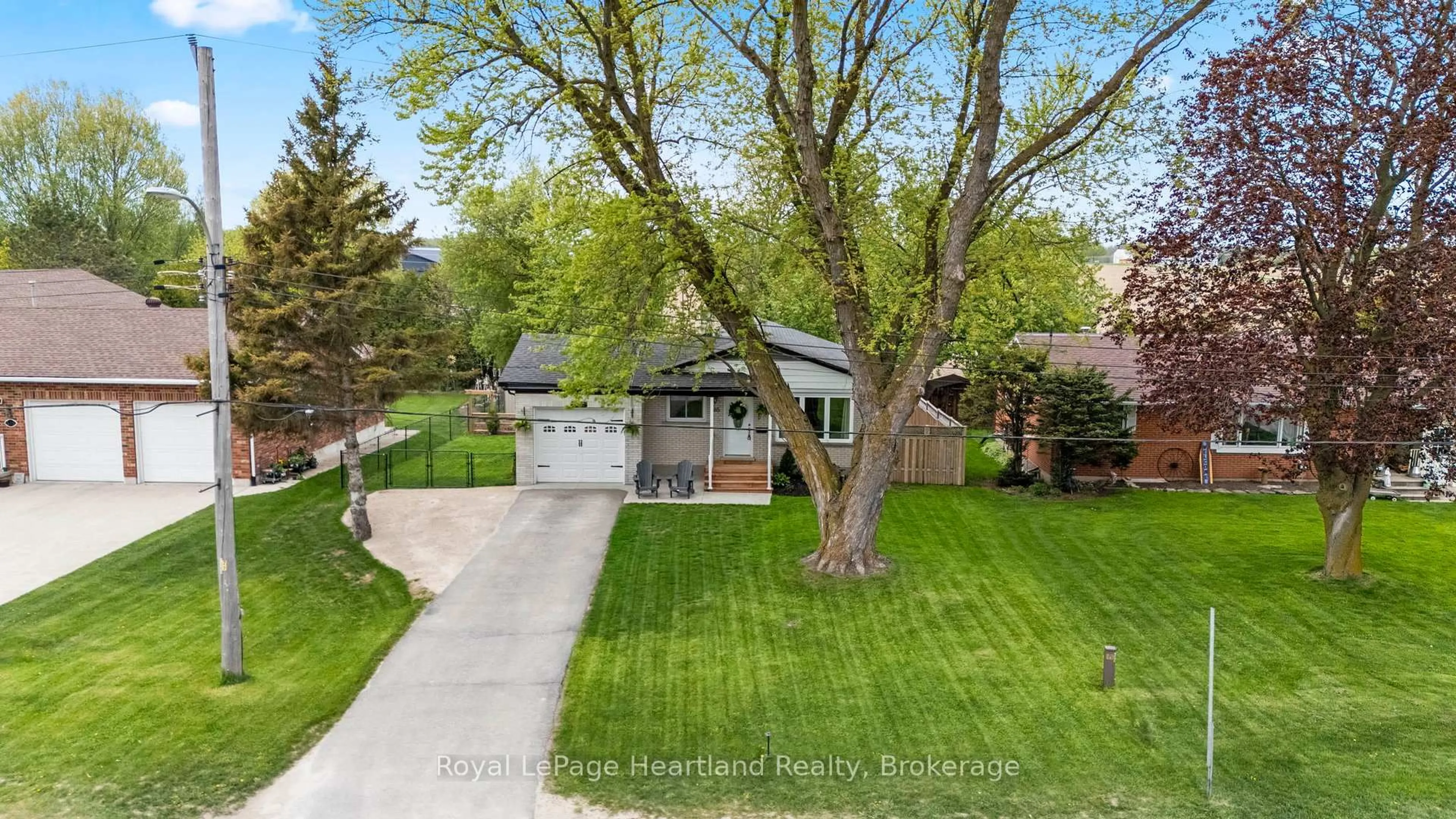A pic from outside/outdoor area/front of a property/back of a property/a pic from drone, street for 465 Main St, Minto Ontario N0G 2P0