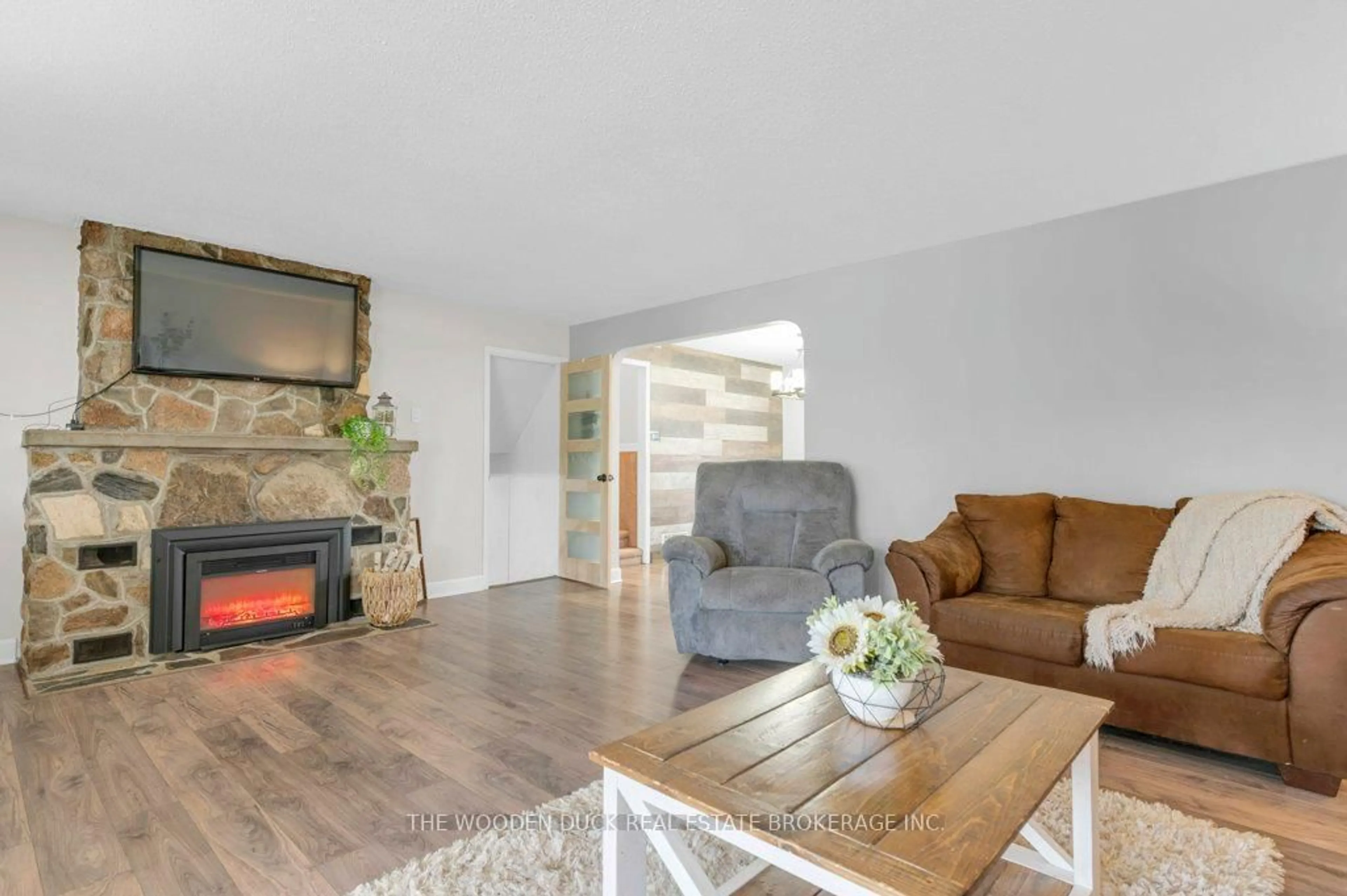 Living room with furniture, wood/laminate floor for 16563 Hwy 62 Rd, Madoc Ontario K0K 2K0