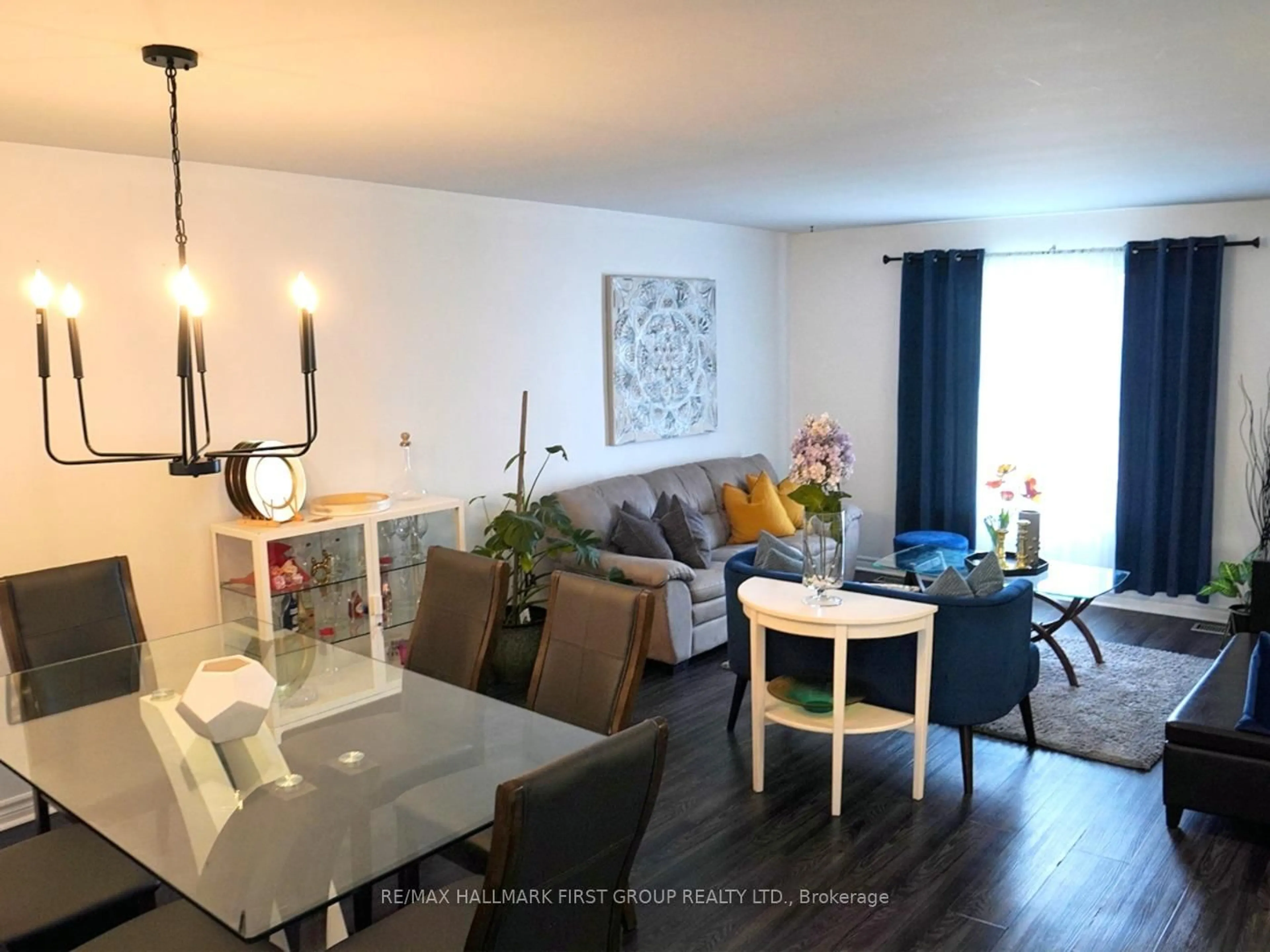 Living room with furniture, wood/laminate floor for 449 Burnham Manor Crt, Cobourg Ontario K9A 5B9