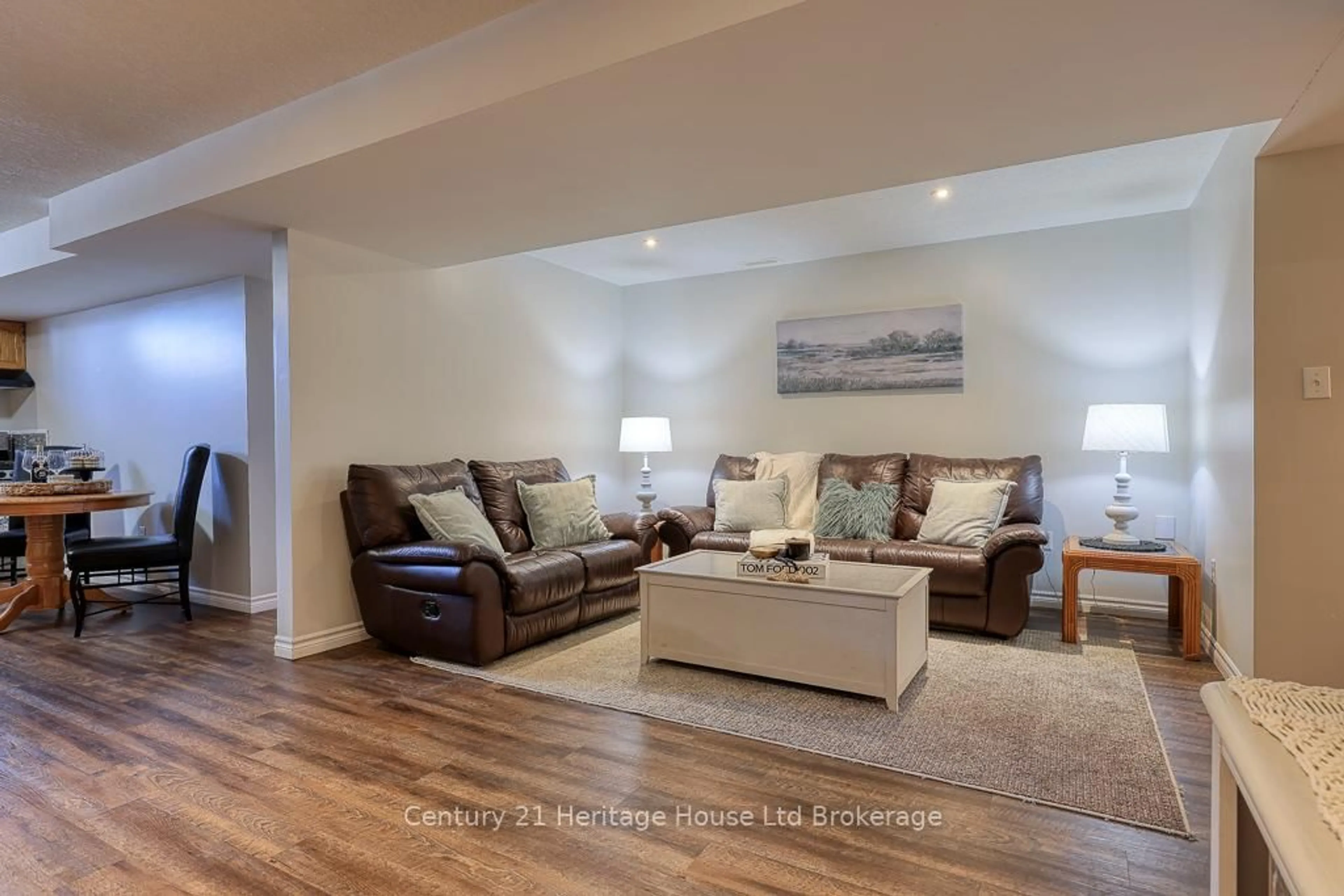 Living room with furniture, wood/laminate floor for 57 Fuller Dr, Ingersoll Ontario N5C 4H4