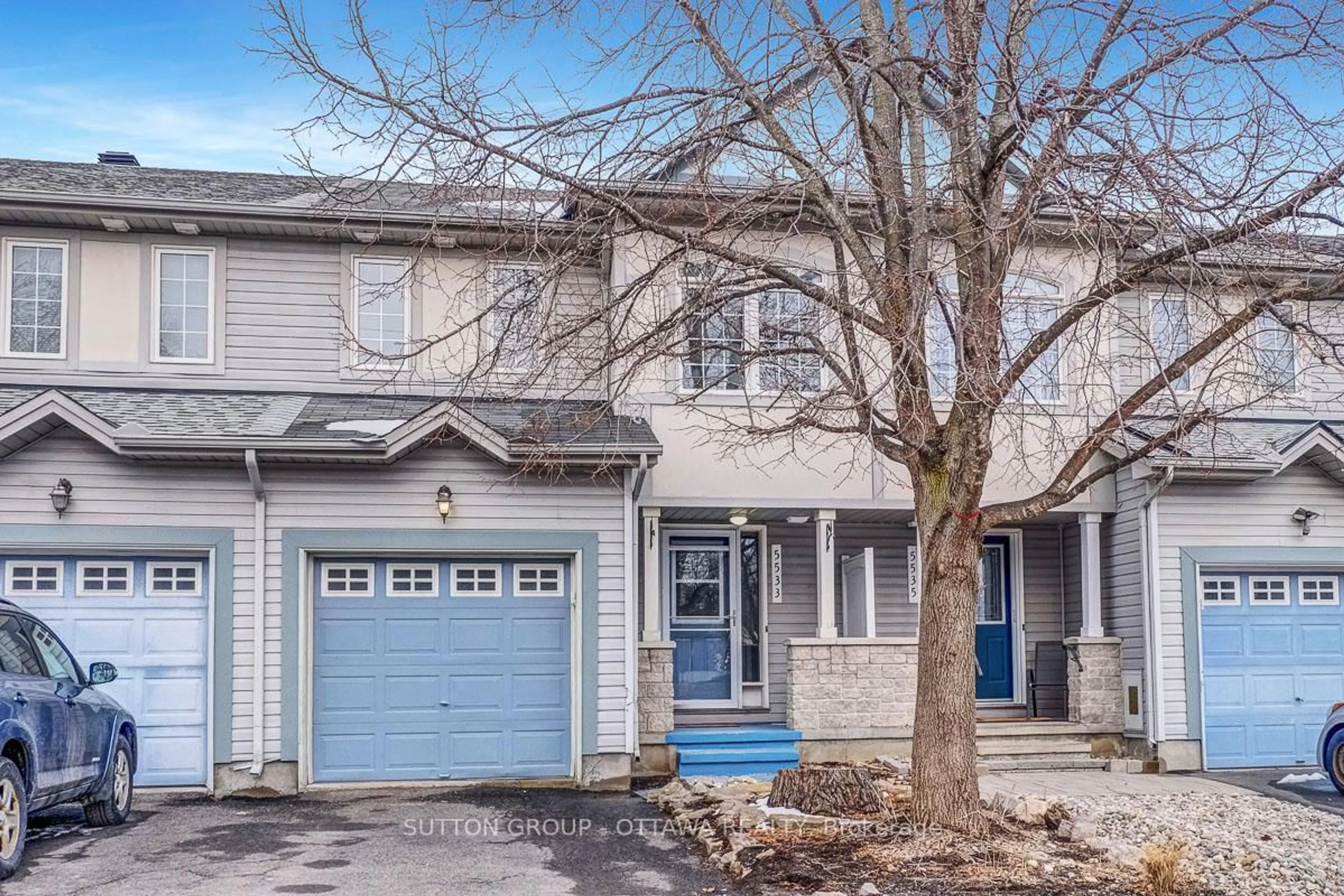 Home with vinyl exterior material, street for 5533 Doctor Leach Dr, Ottawa Ontario K4M 1L6