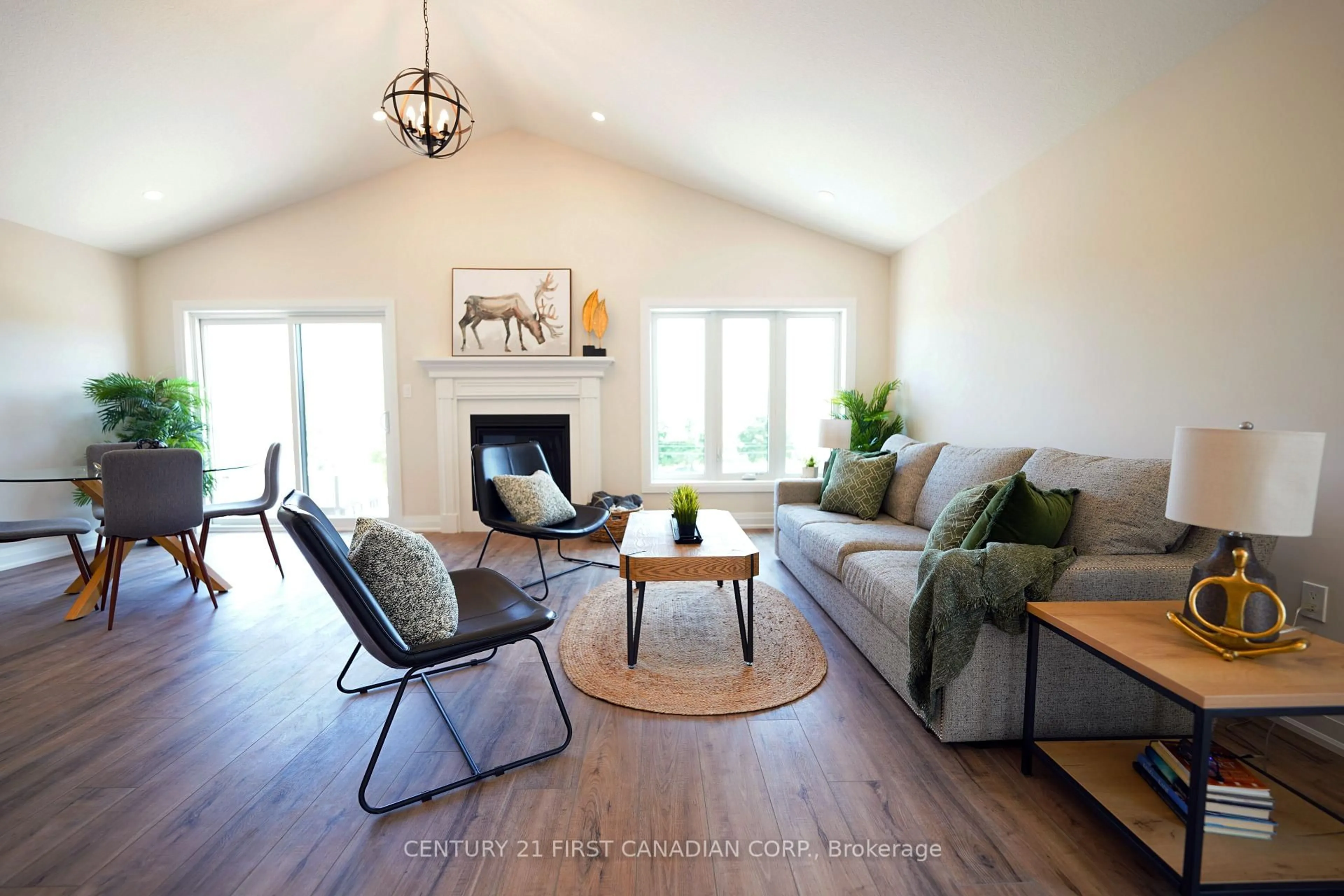 Living room with furniture, wood/laminate floor for 7 Doerr Crt, North Middlesex Ontario N0M 1A0
