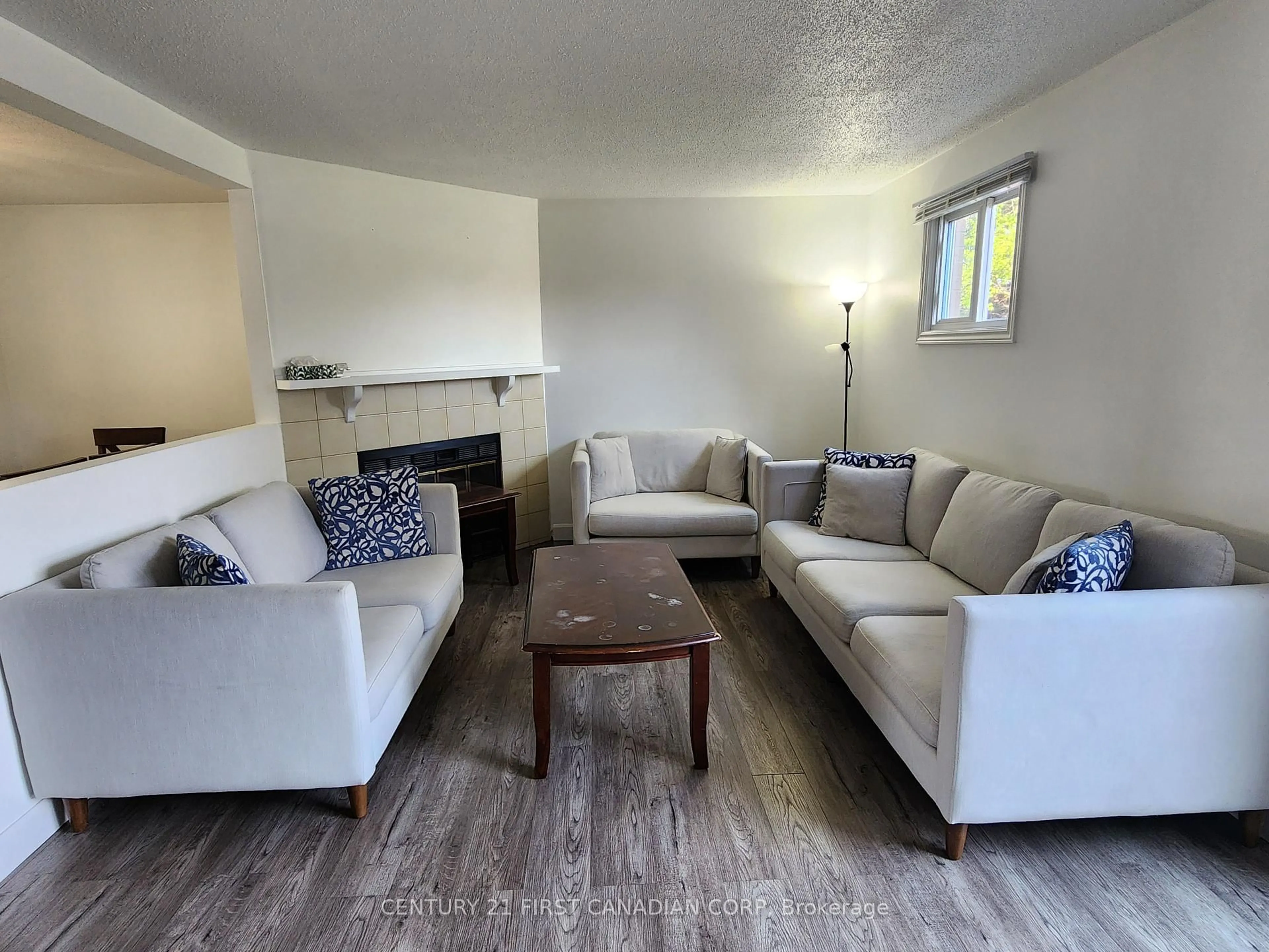 Living room with furniture, wood/laminate floor for 1318 Highbury Ave #54, London East Ontario N5Y 5E5