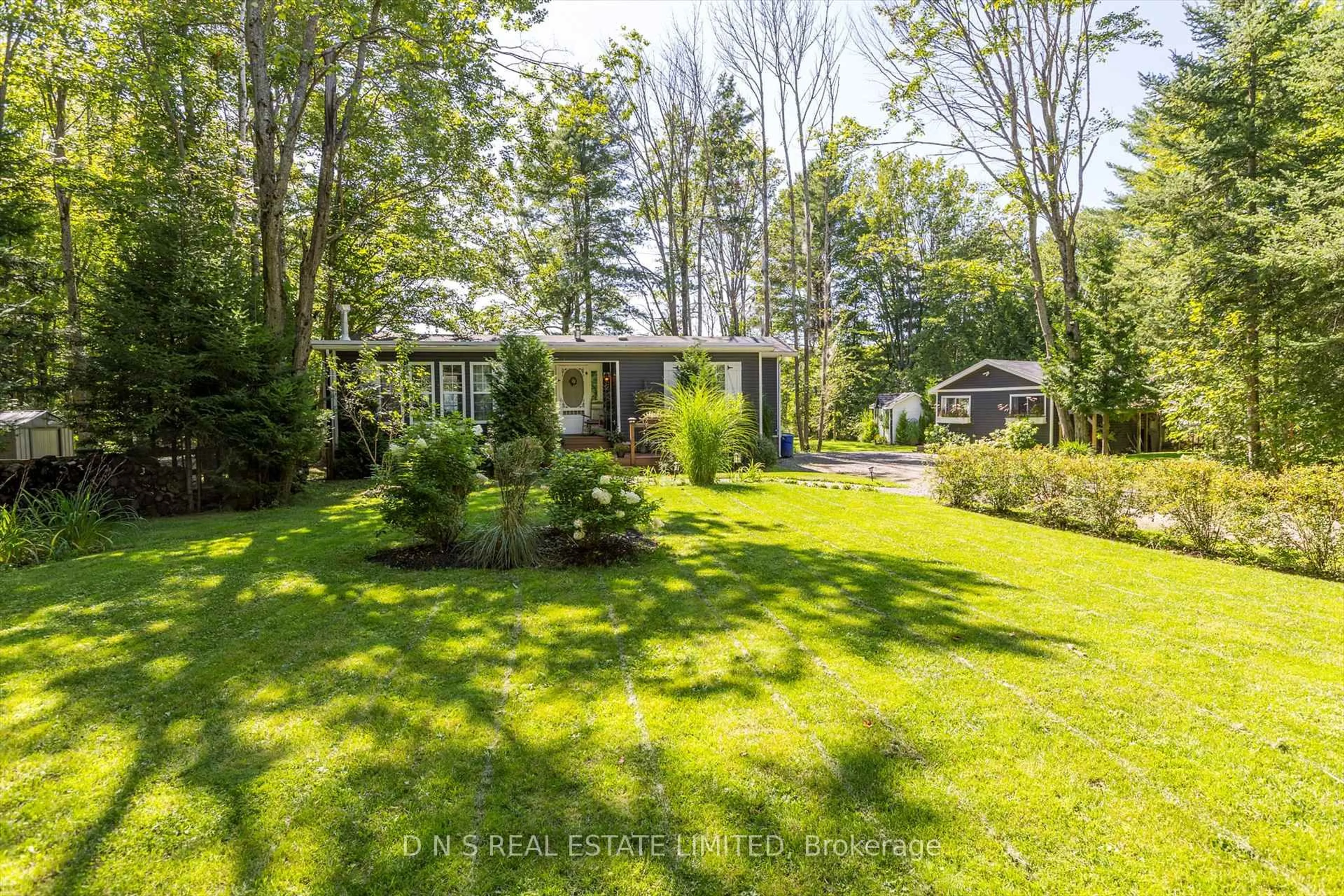 A pic from outside/outdoor area/front of a property/back of a property/a pic from drone, forest/trees view for 14 Robinson Lane, Bancroft Ontario K0L 2L0