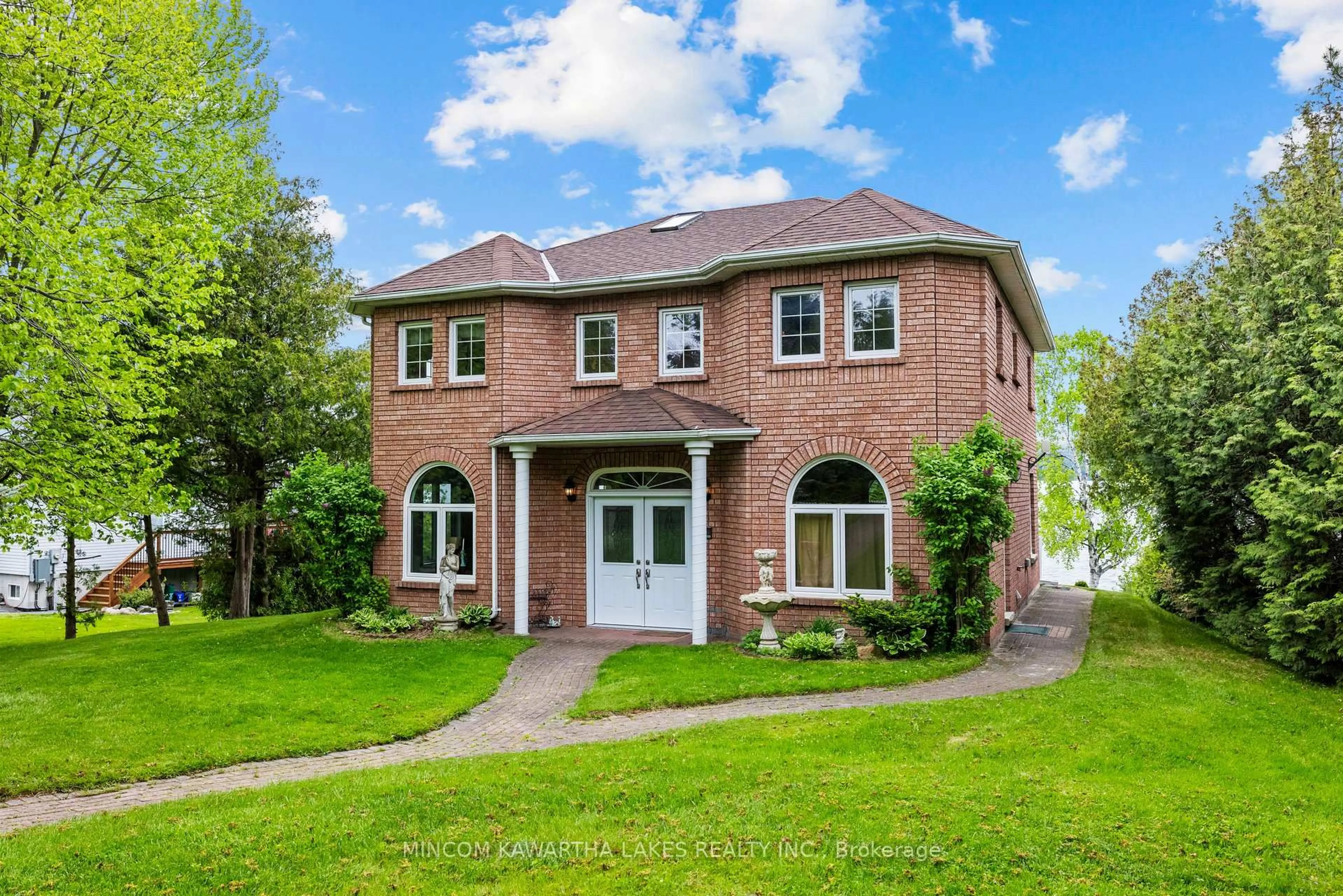 Home with brick exterior material, street for 631 North Shore Dr, Otonabee-South Monaghan Ontario K0L 1B0