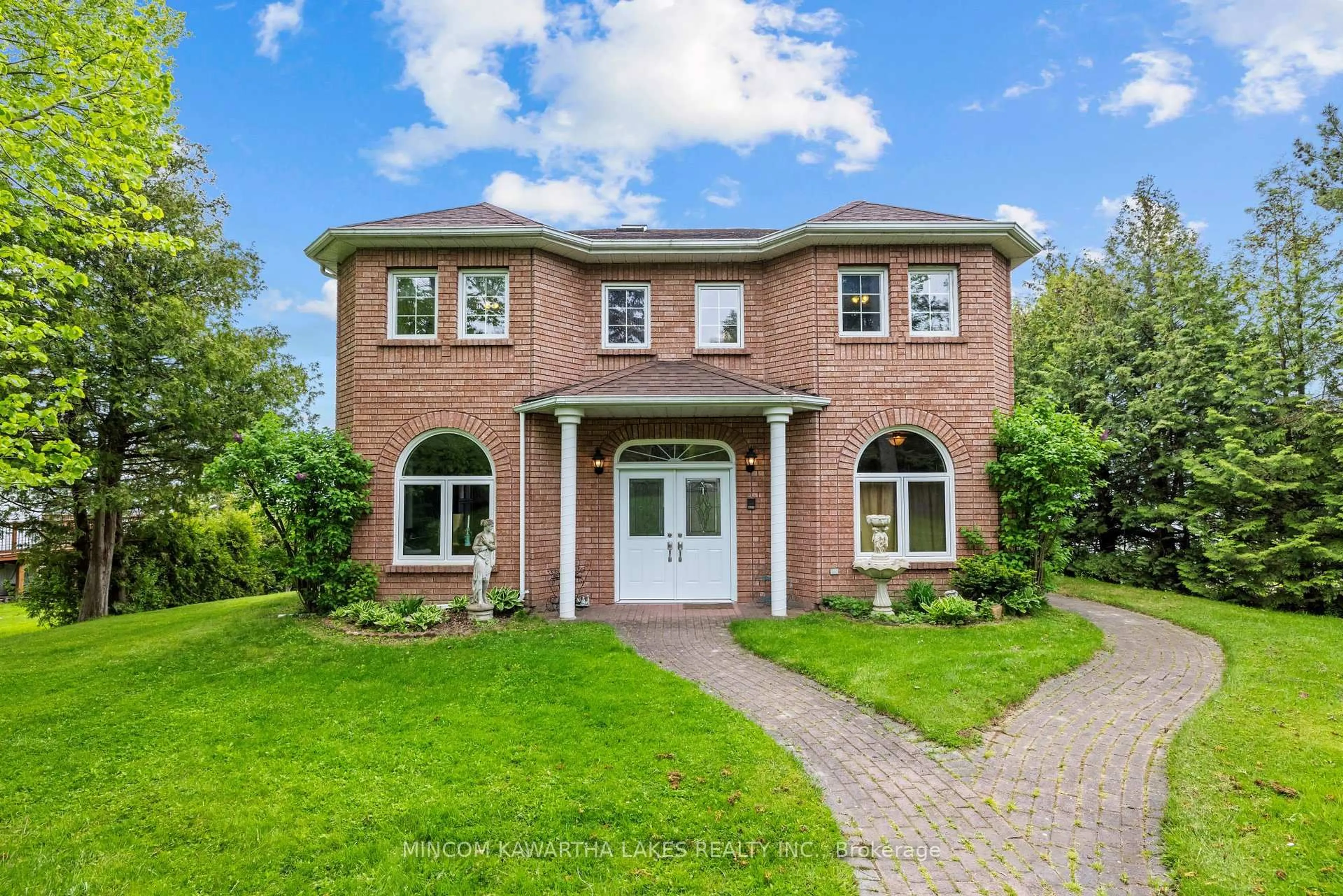 Home with brick exterior material, street for 631 North Shore Dr, Otonabee-South Monaghan Ontario K0L 1B0
