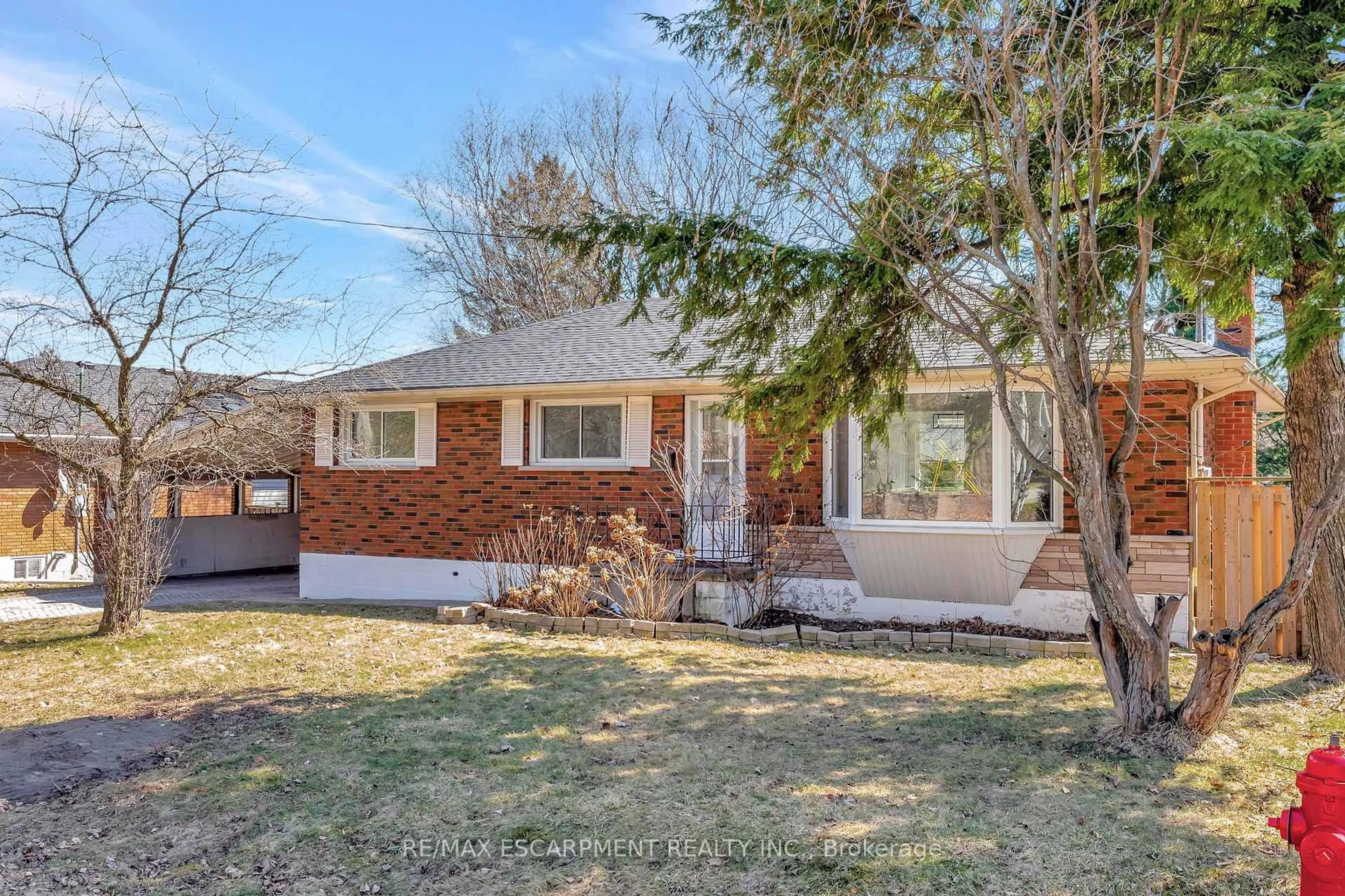 Home with brick exterior material, street for 216 Sioux Rd, Hamilton Ontario L9G 1P8
