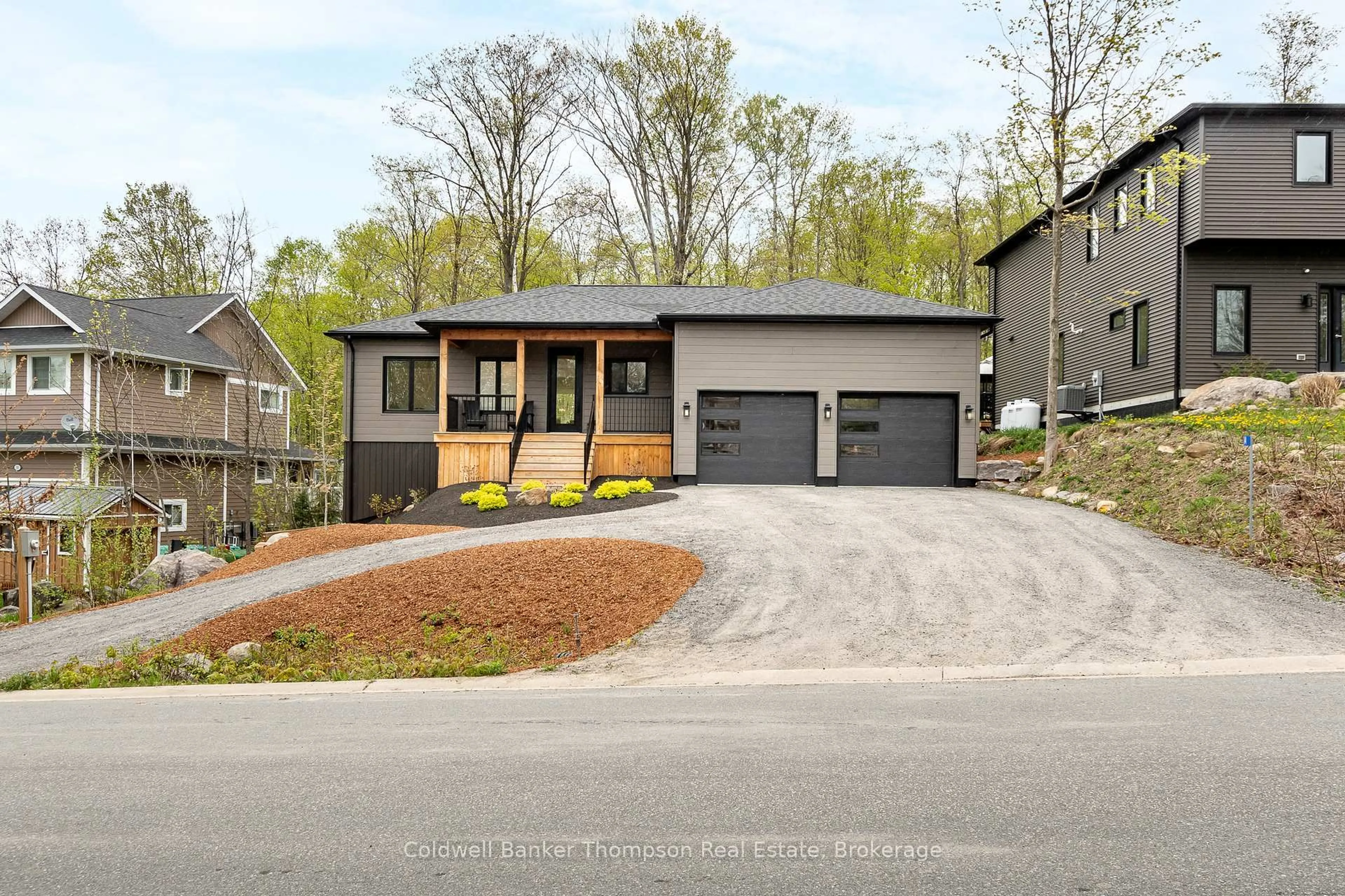Home with brick exterior material, street for 14 Mackenzie Dr, Huntsville Ontario P1H 0A1