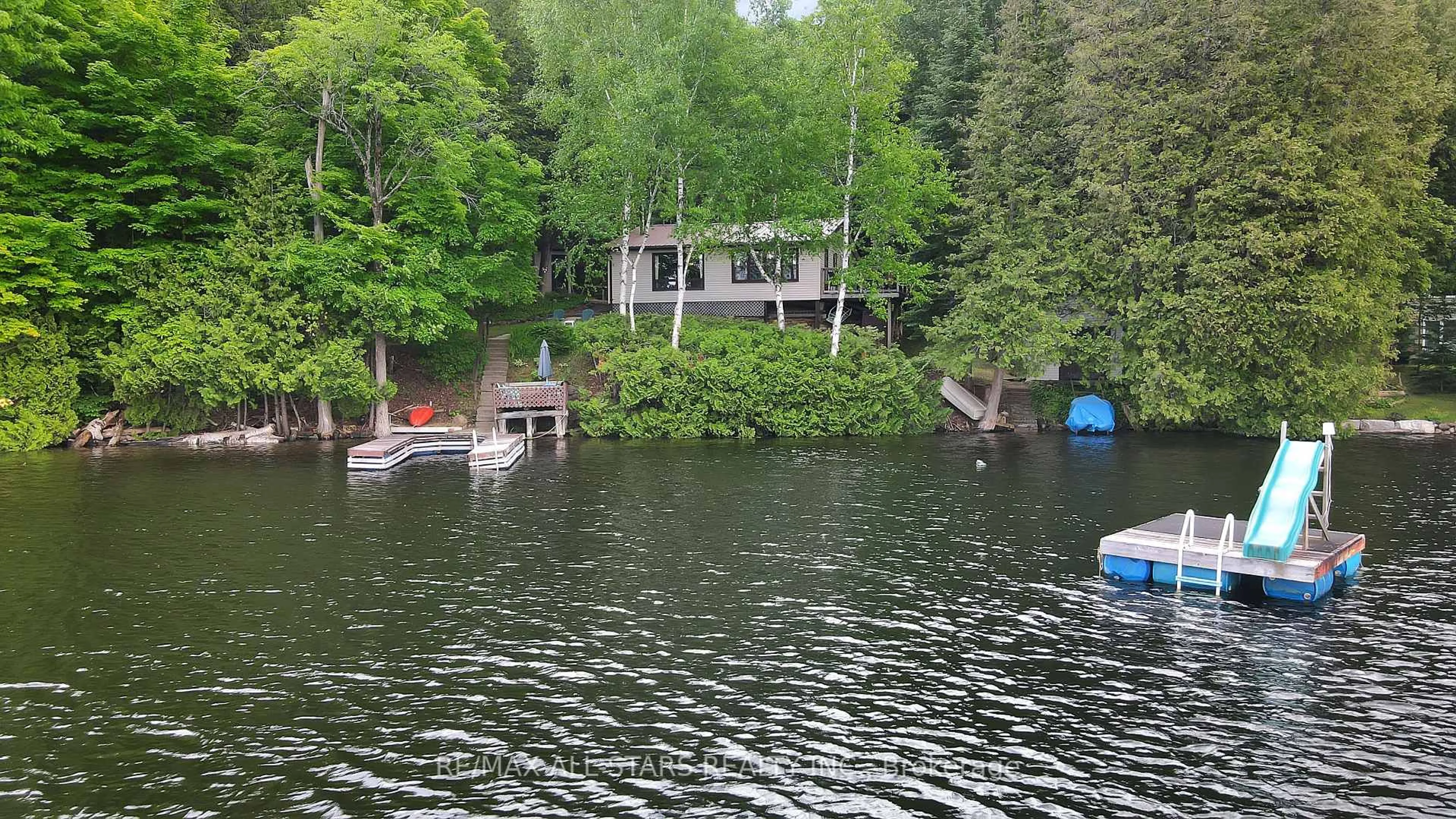 A pic from outside/outdoor area/front of a property/back of a property/a pic from drone, water/lake/river/ocean view for 1233 Crystal Lake Rd, Trent Lakes Ontario K0M 2A0