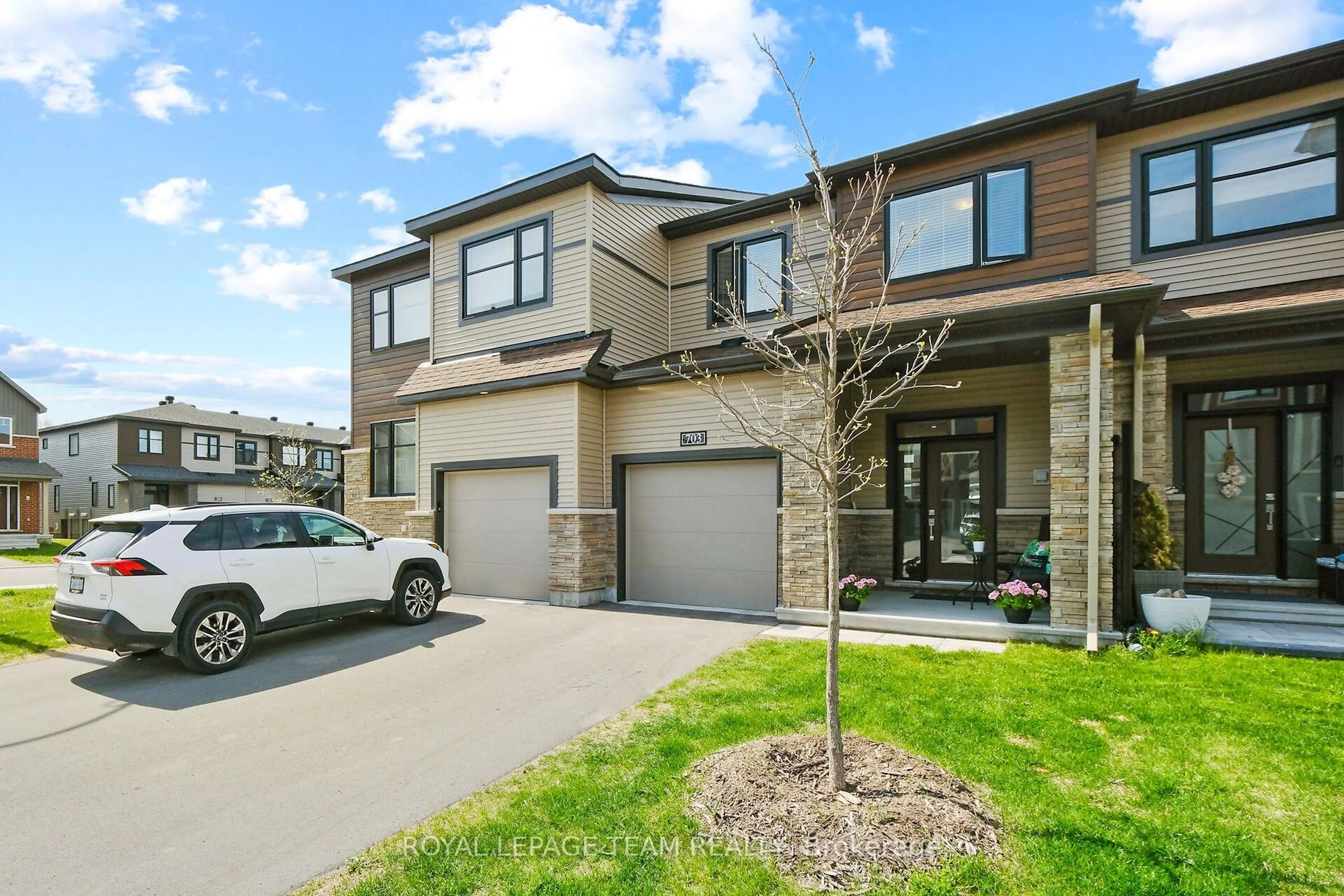 Home with brick exterior material, street for 703 Doneraile Walk, Ottawa Ontario K2J 7B9