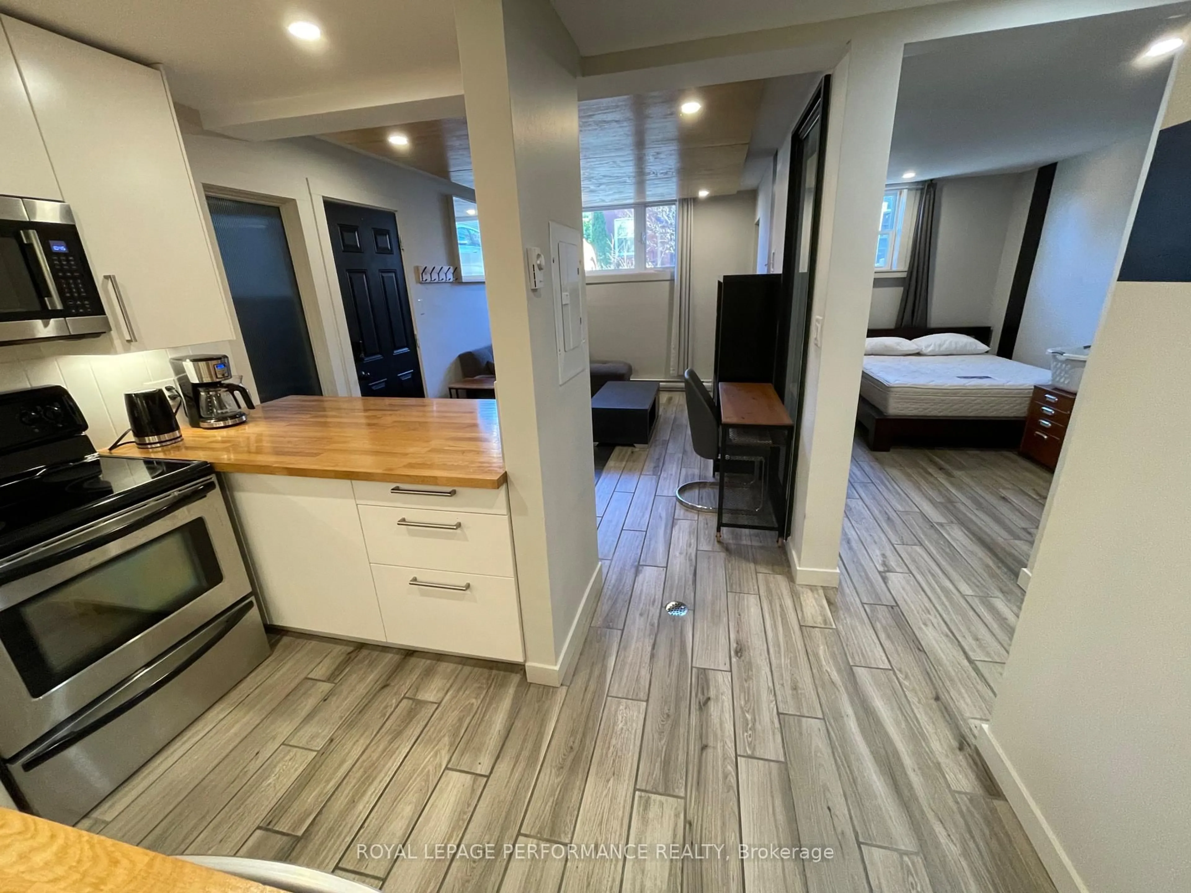 Open concept kitchen, wood/laminate floor for 10 Sherbrooke Ave, Ottawa Ontario K1Y 1R7