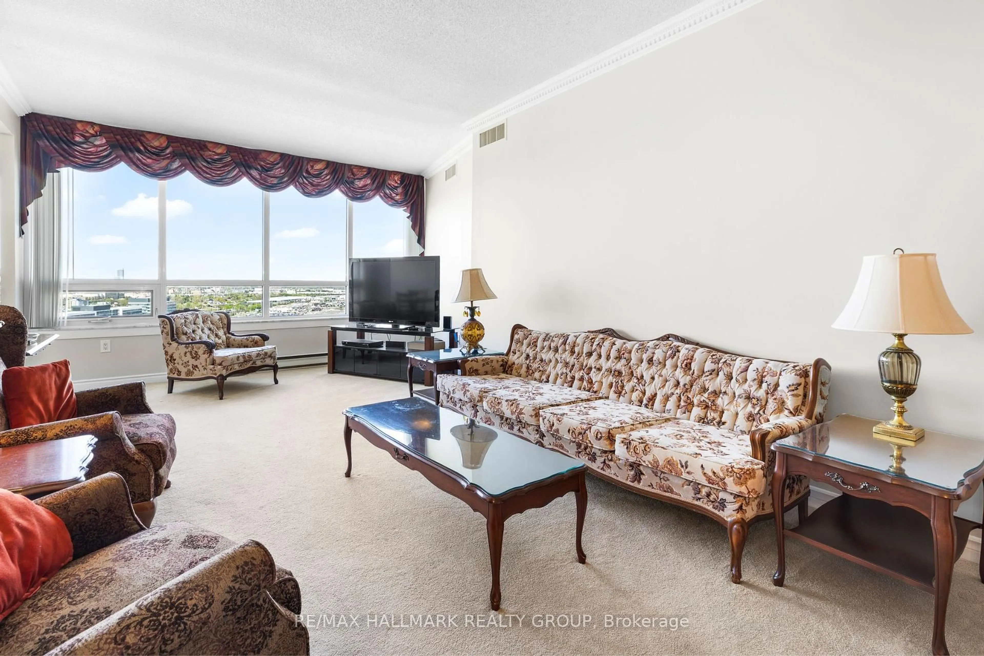 Living room with furniture, carpet floor for 1480 Riverside Dr #2403, Ottawa Ontario K1G 5H2