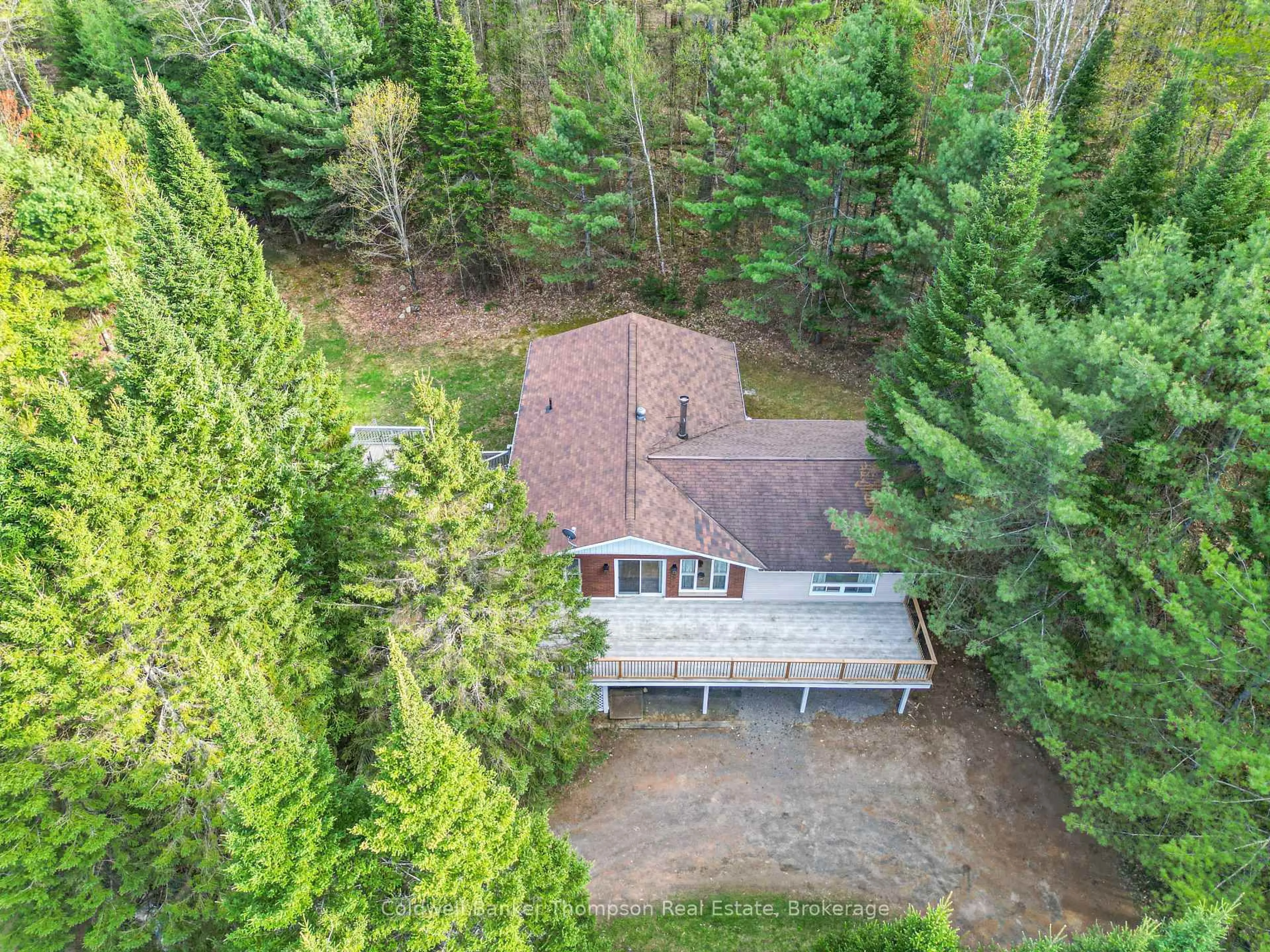 A pic from outside/outdoor area/front of a property/back of a property/a pic from drone, forest/trees view for 1459 Ravenscliffe Rd, Huntsville Ontario P1H 2J2