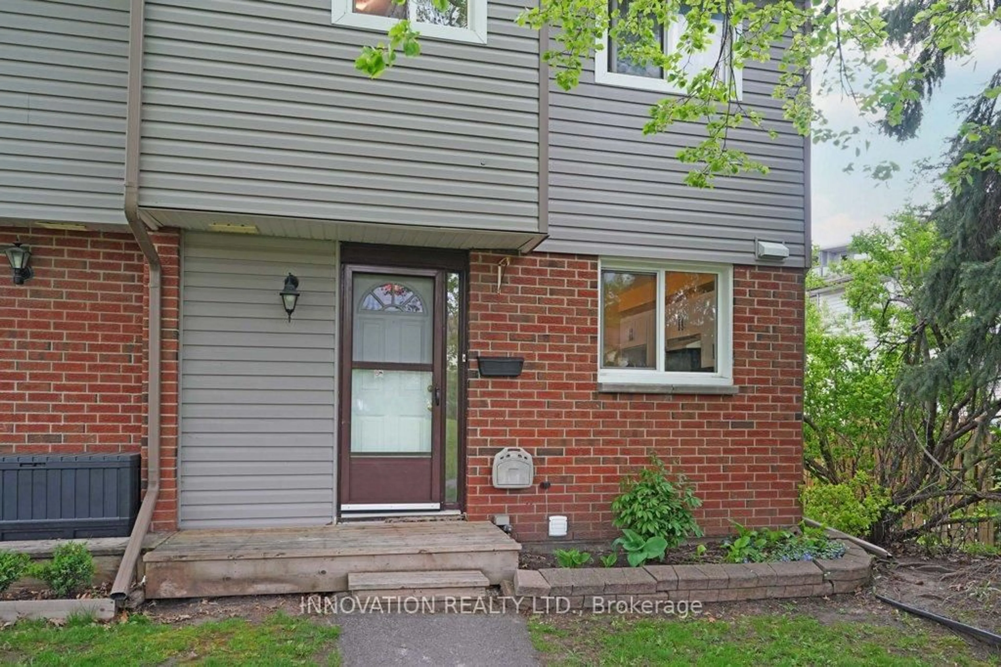 Home with brick exterior material, street for 1389 Palmerston Dr #116, Ottawa Ontario K1J 8N9