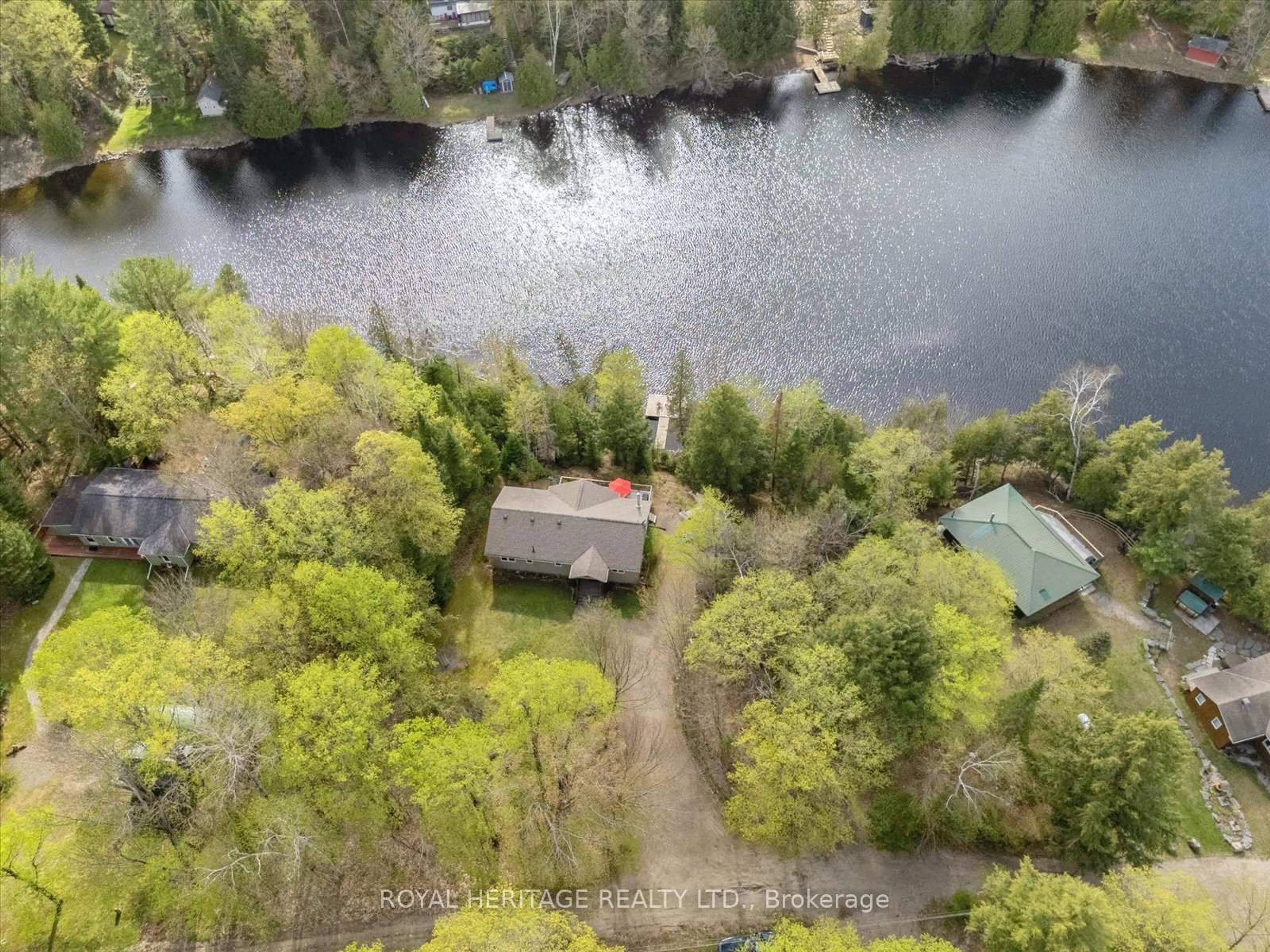 A pic from outside/outdoor area/front of a property/back of a property/a pic from drone, water/lake/river/ocean view for 1037 Alvic Lane, Minden Hills Ontario K0M 2K0