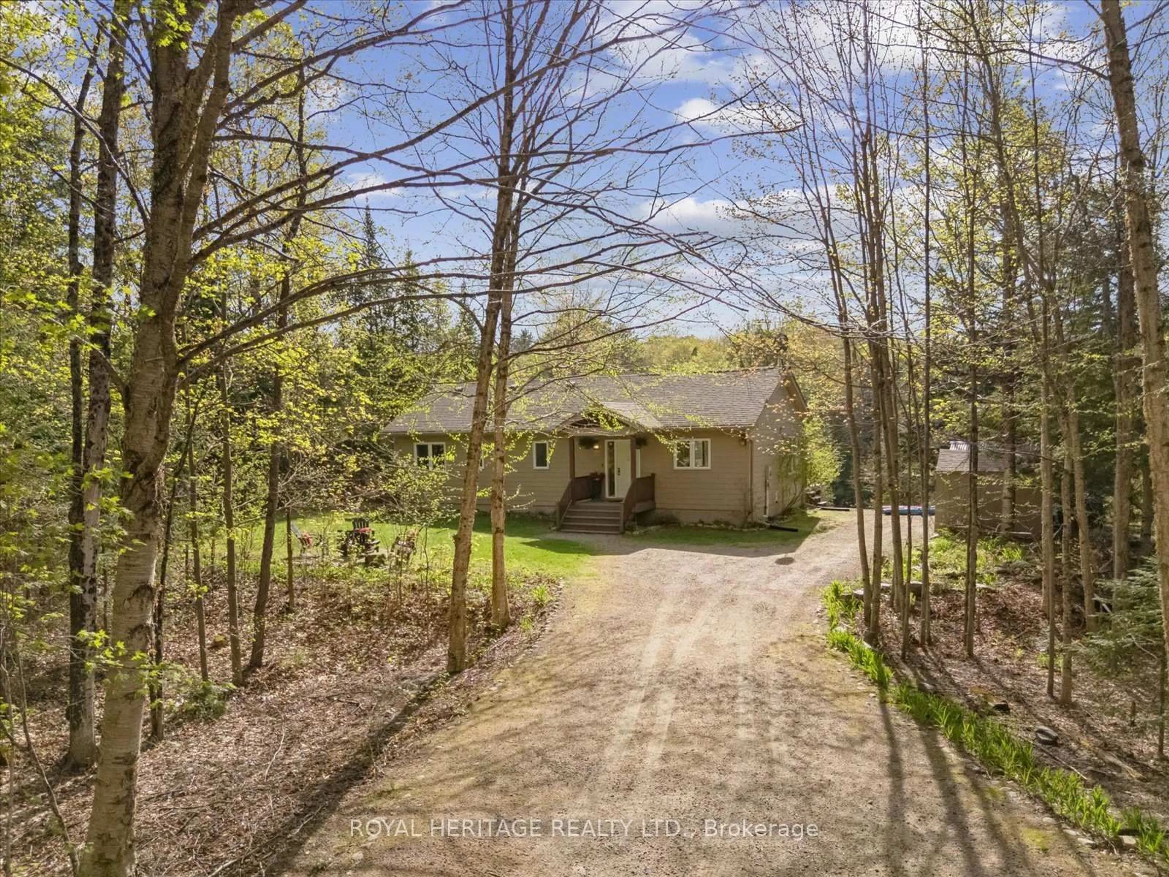 A pic from outside/outdoor area/front of a property/back of a property/a pic from drone, forest/trees view for 1037 Alvic Lane, Minden Hills Ontario K0M 2K0