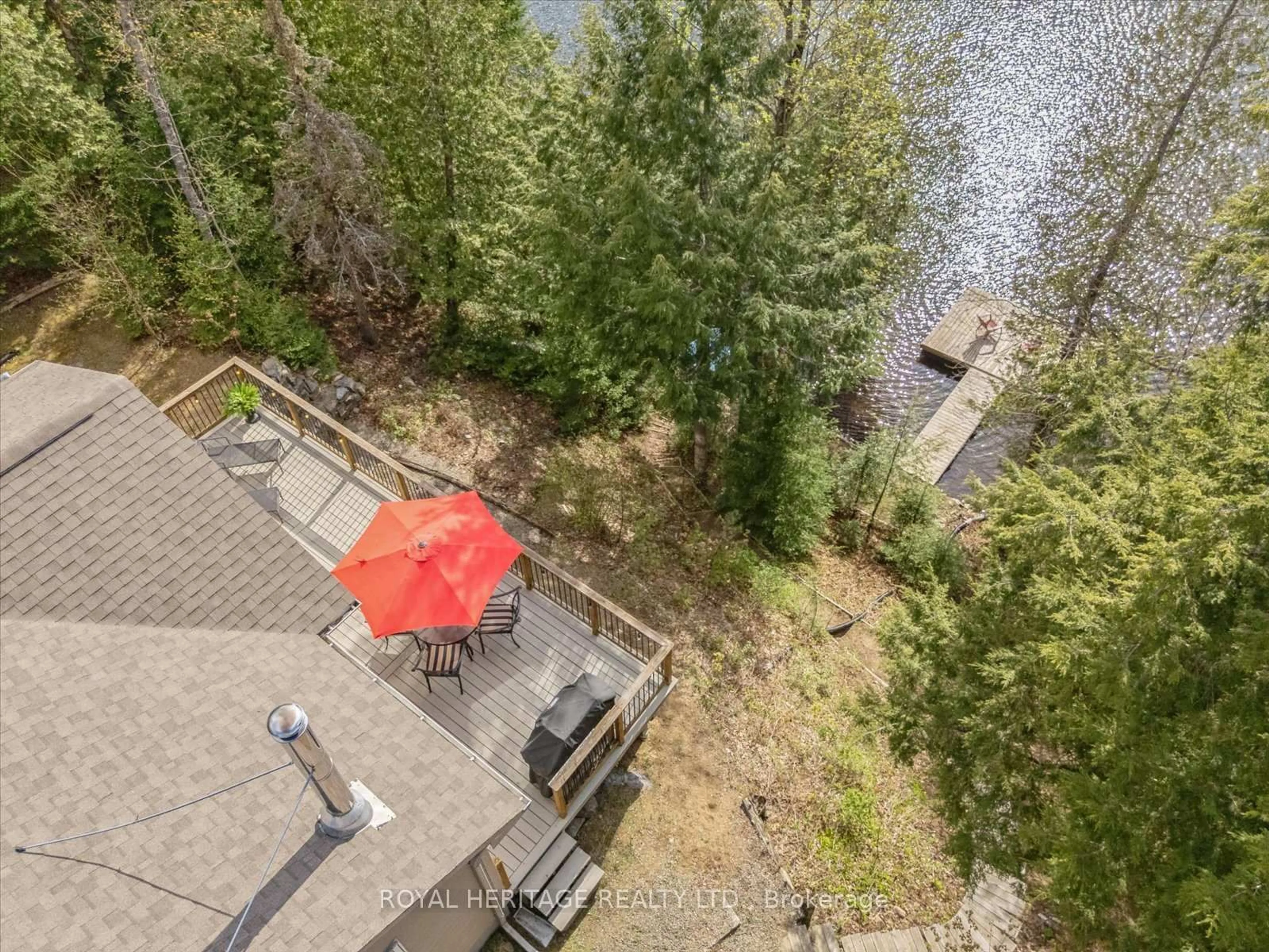 A pic from outside/outdoor area/front of a property/back of a property/a pic from drone, water/lake/river/ocean view for 1037 Alvic Lane, Minden Hills Ontario K0M 2K0