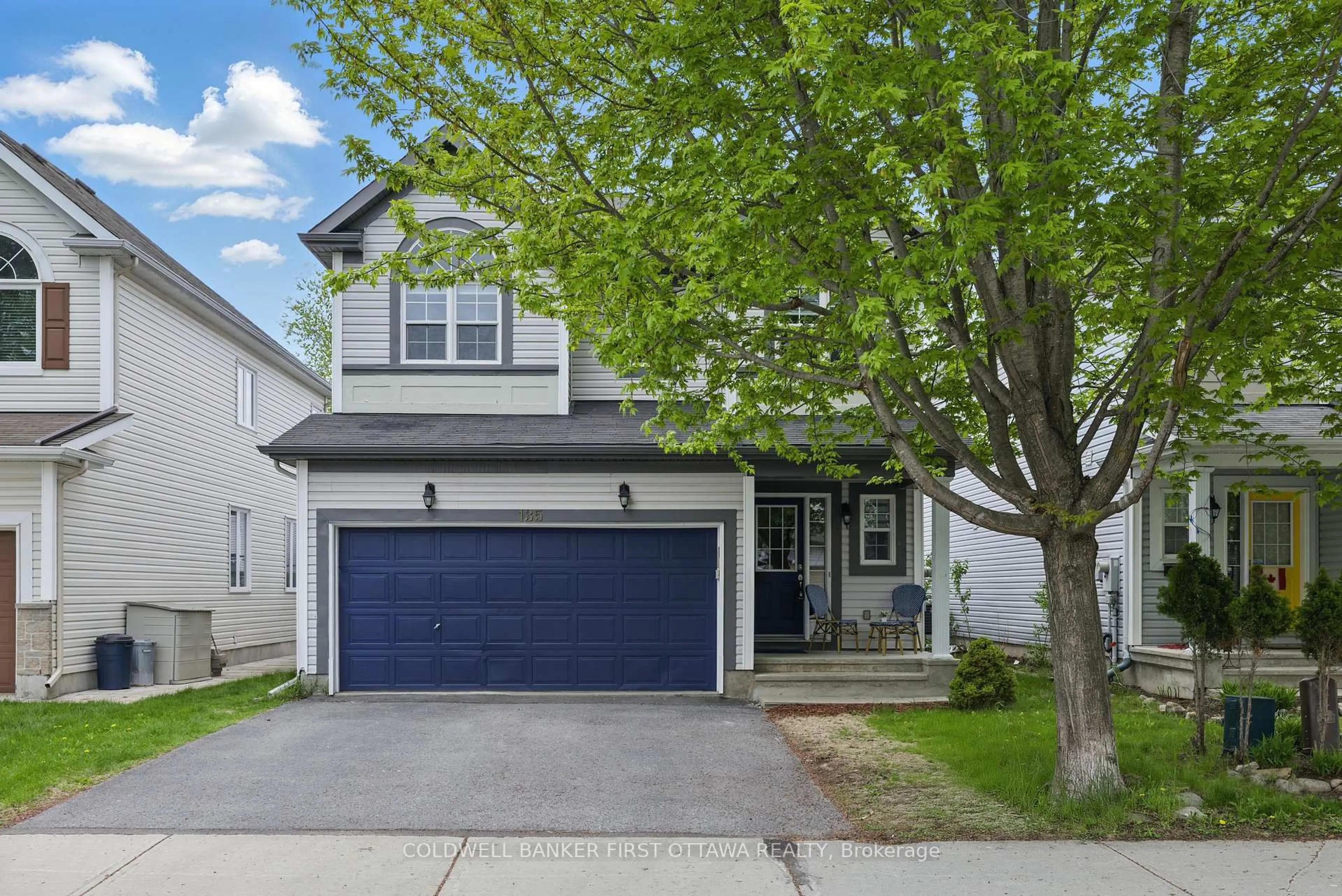 Home with vinyl exterior material, street for 135 Lamplighters Dr, Ottawa Ontario K2J 0C1