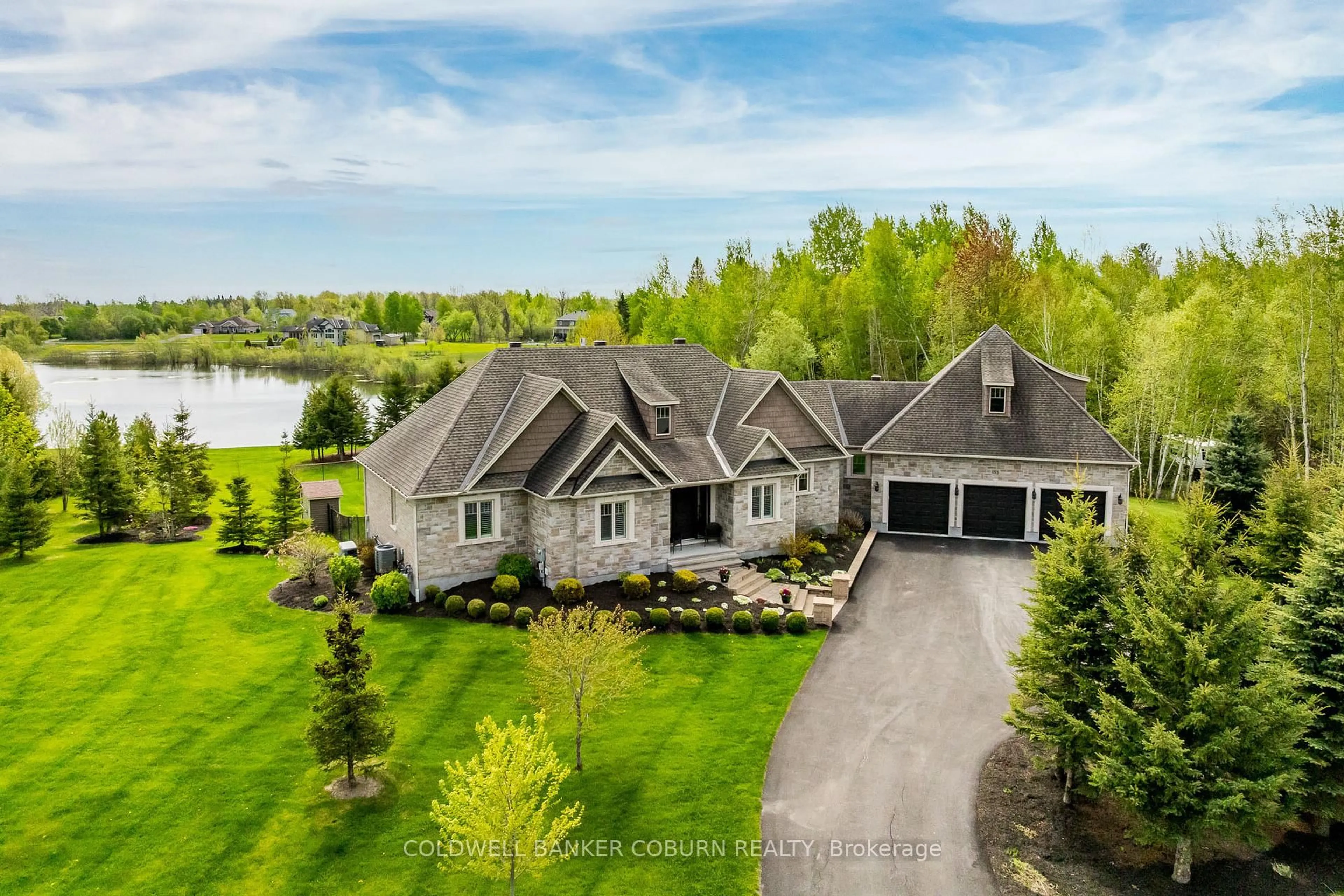 A pic from outside/outdoor area/front of a property/back of a property/a pic from drone, water/lake/river/ocean view for 155 West Lake Circ, Carp Ontario K0A 1L0