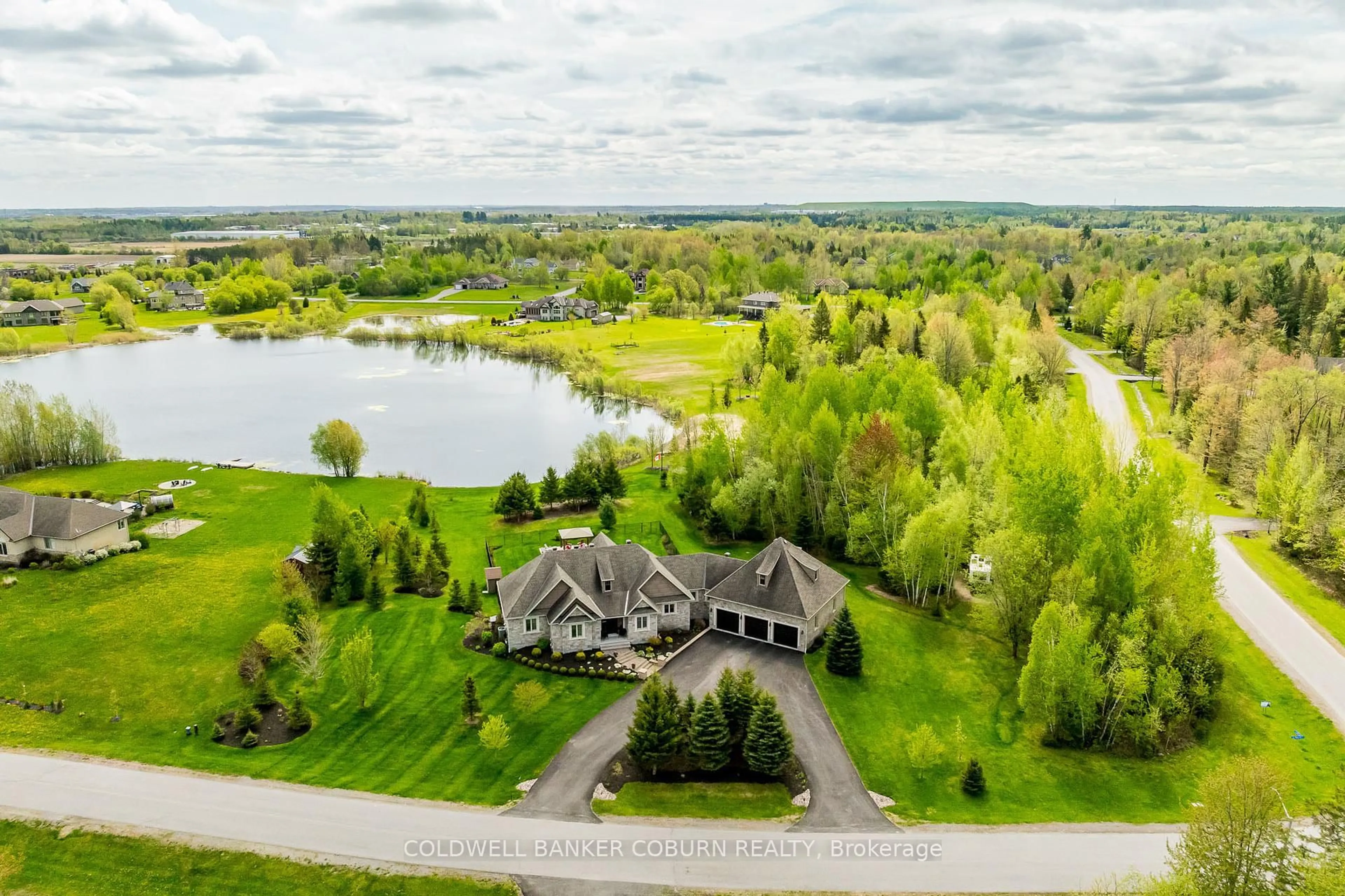 A pic from outside/outdoor area/front of a property/back of a property/a pic from drone, water/lake/river/ocean view for 155 West Lake Circ, Carp Ontario K0A 1L0