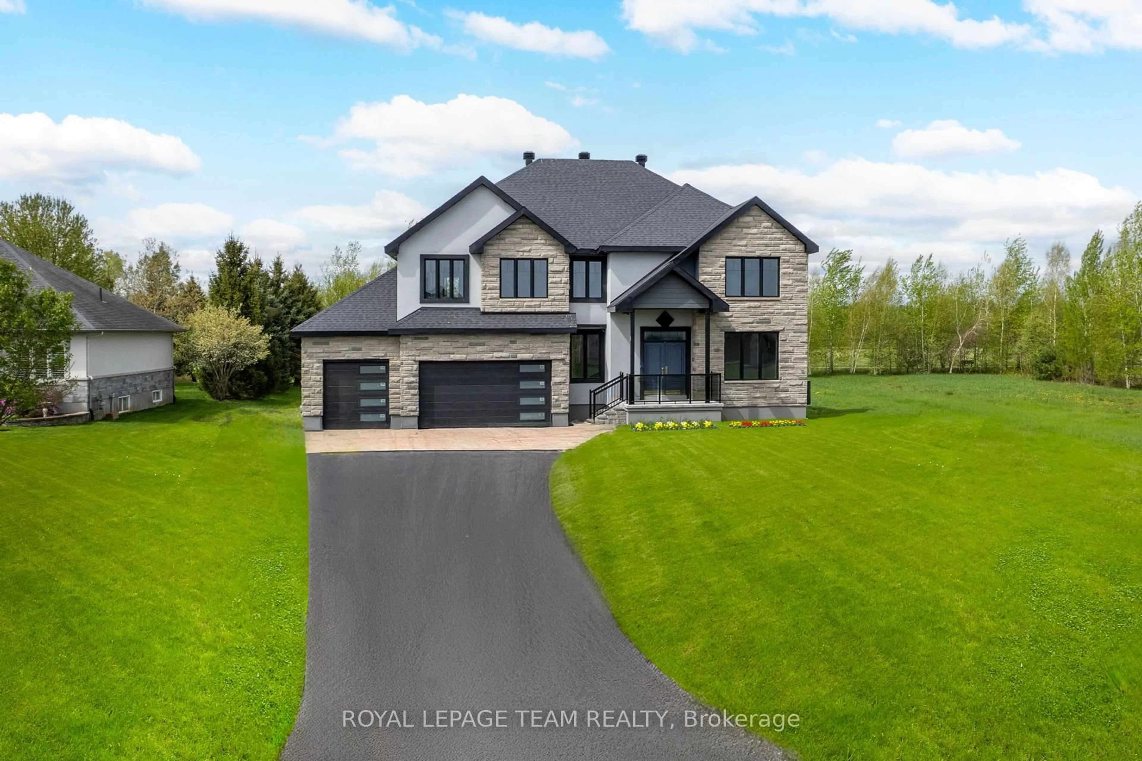 A pic from outside/outdoor area/front of a property/back of a property/a pic from drone, street for 1444 Water's Edge Way, Greely Ontario K4P 0C6
