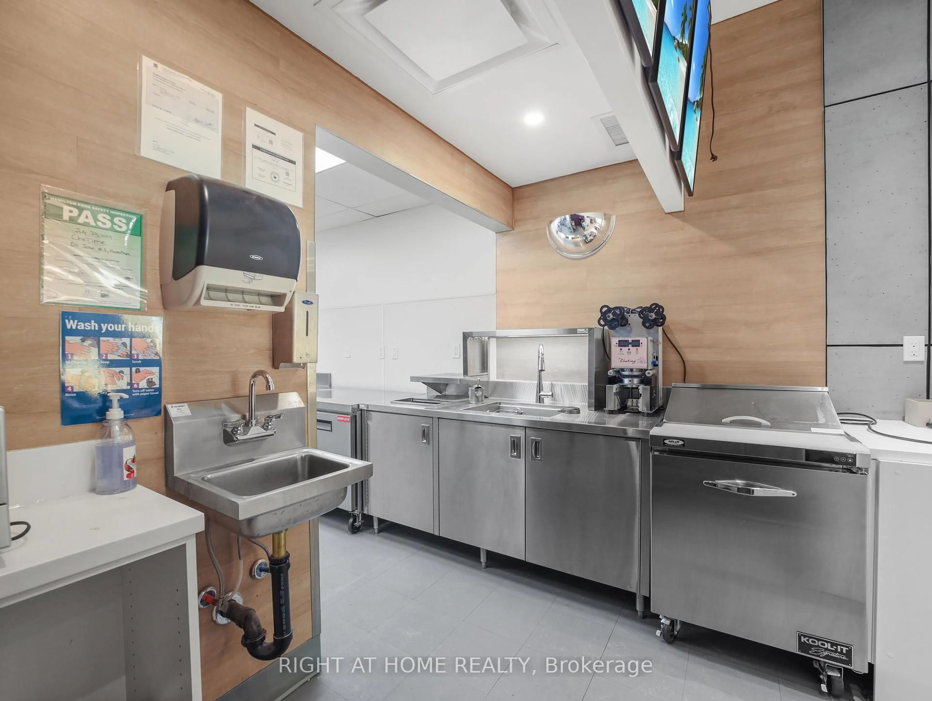Kitchen with laundary machines, unknown for 84 - 86 John St, Hamilton Ontario L8N 2C1