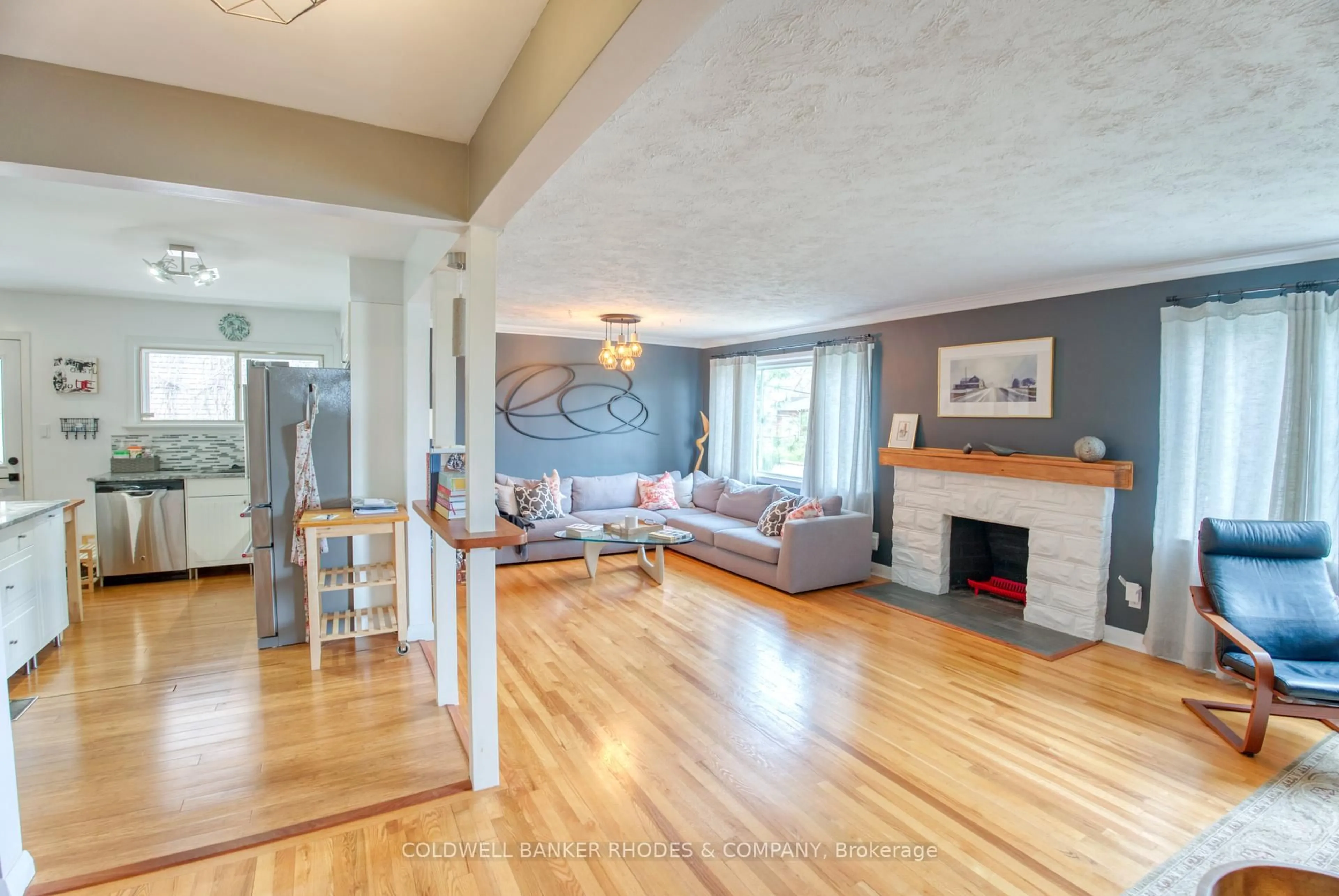 Living room with furniture, wood/laminate floor for 2066 Black Friars Rd, Ottawa Ontario K2A 3K5
