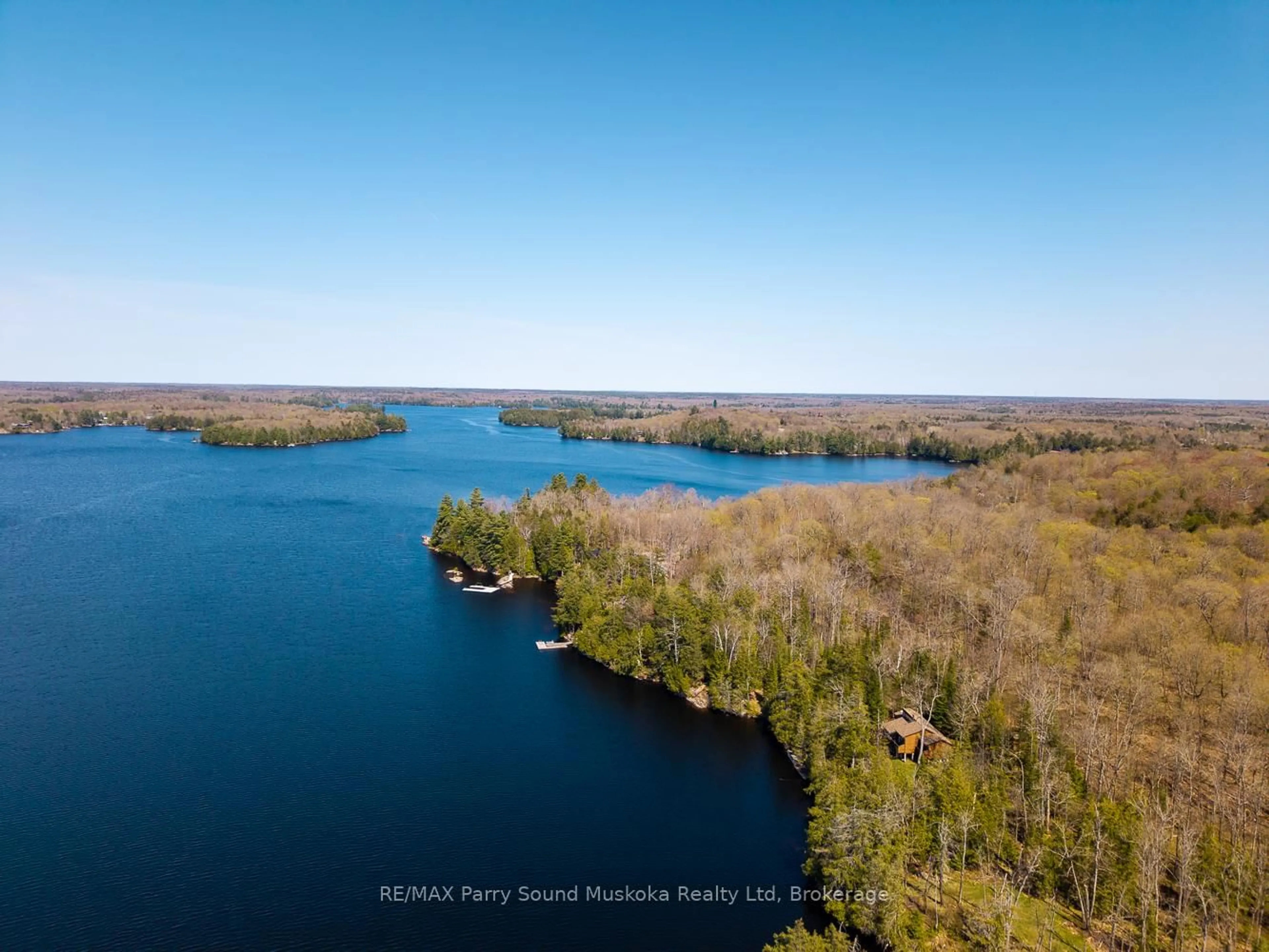 A pic from outside/outdoor area/front of a property/back of a property/a pic from drone, water/lake/river/ocean view for 23 & 25 Dancy Lane, McKellar Ontario P2A 0B5