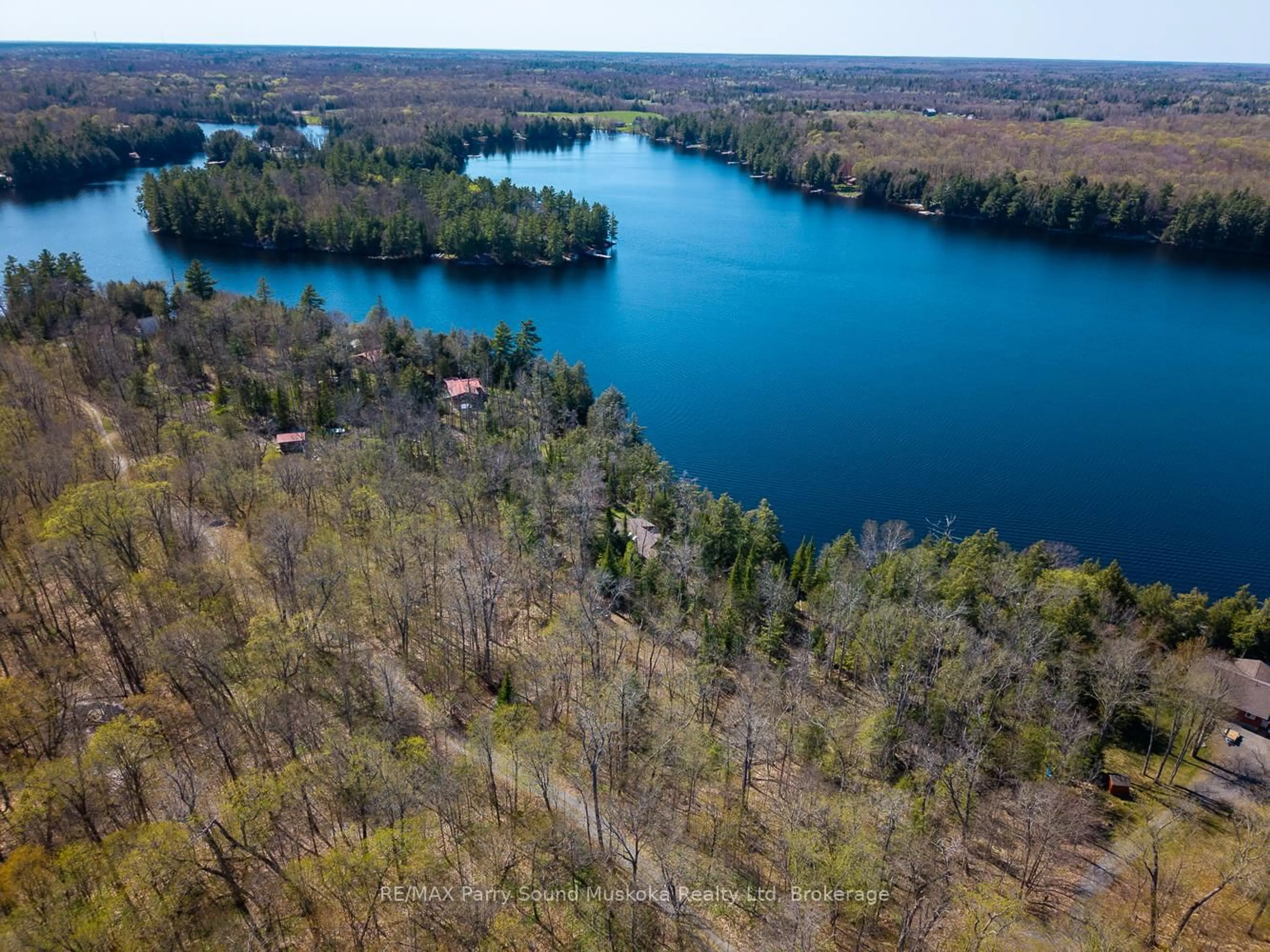 A pic from outside/outdoor area/front of a property/back of a property/a pic from drone, water/lake/river/ocean view for 23 & 25 Dancy Lane, McKellar Ontario P2A 0B5