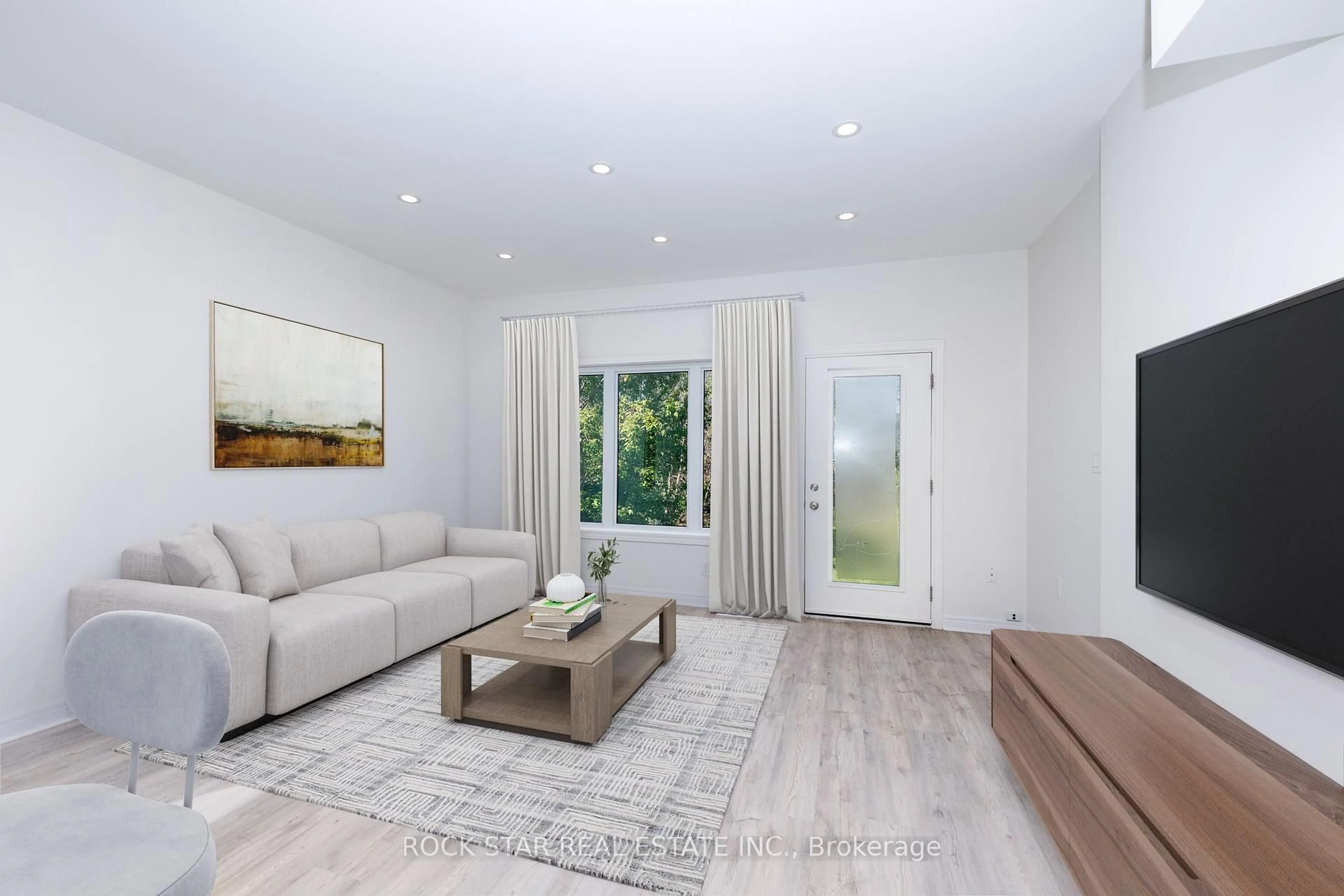 Living room with furniture, wood/laminate floor for 52B Merigold St, St. Catharines Ontario L2S 2N5