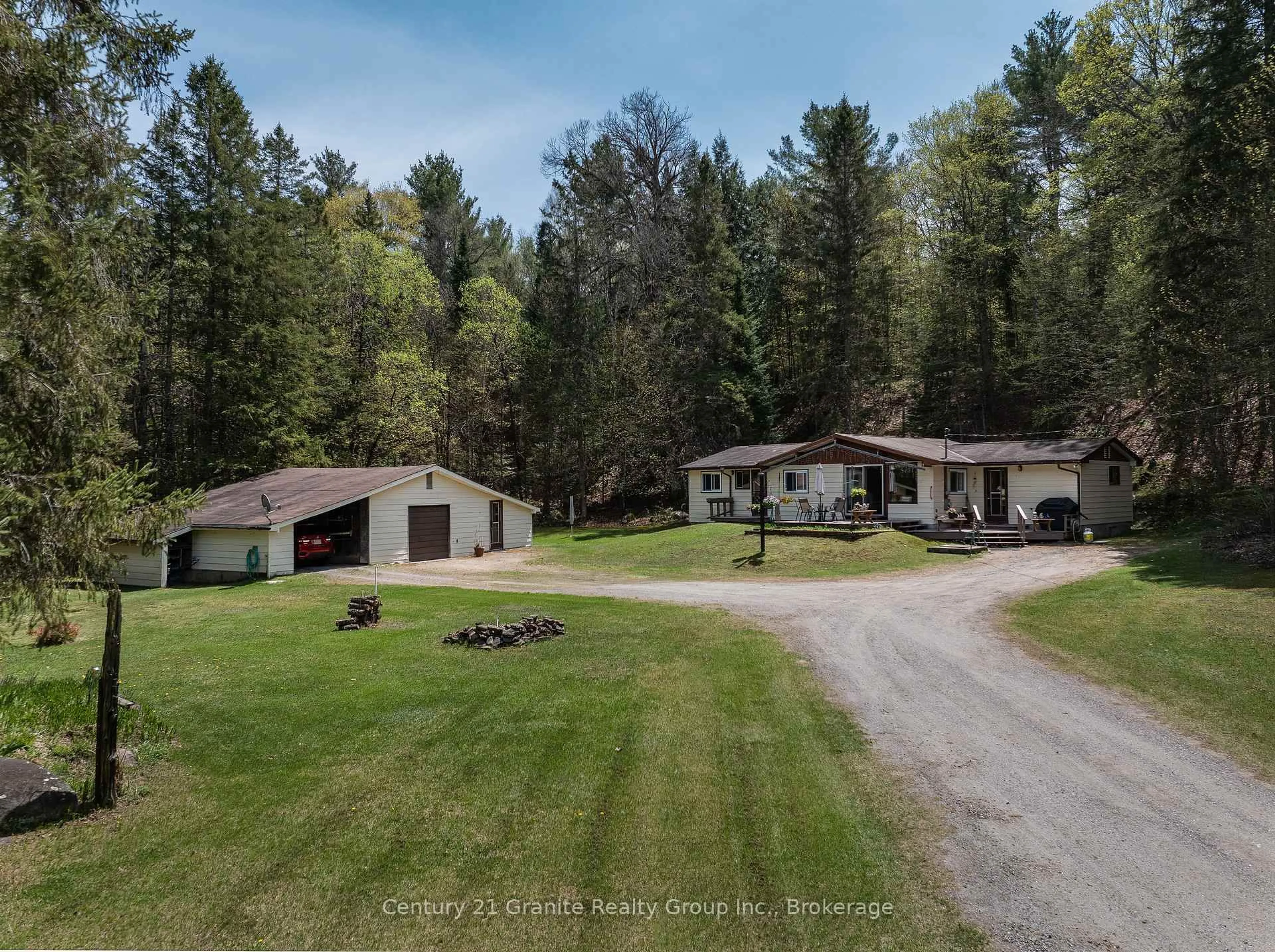 A pic from outside/outdoor area/front of a property/back of a property/a pic from drone, forest/trees view for 1036 Wandering Lane, Algonquin Highlands Ontario K0M 1S0