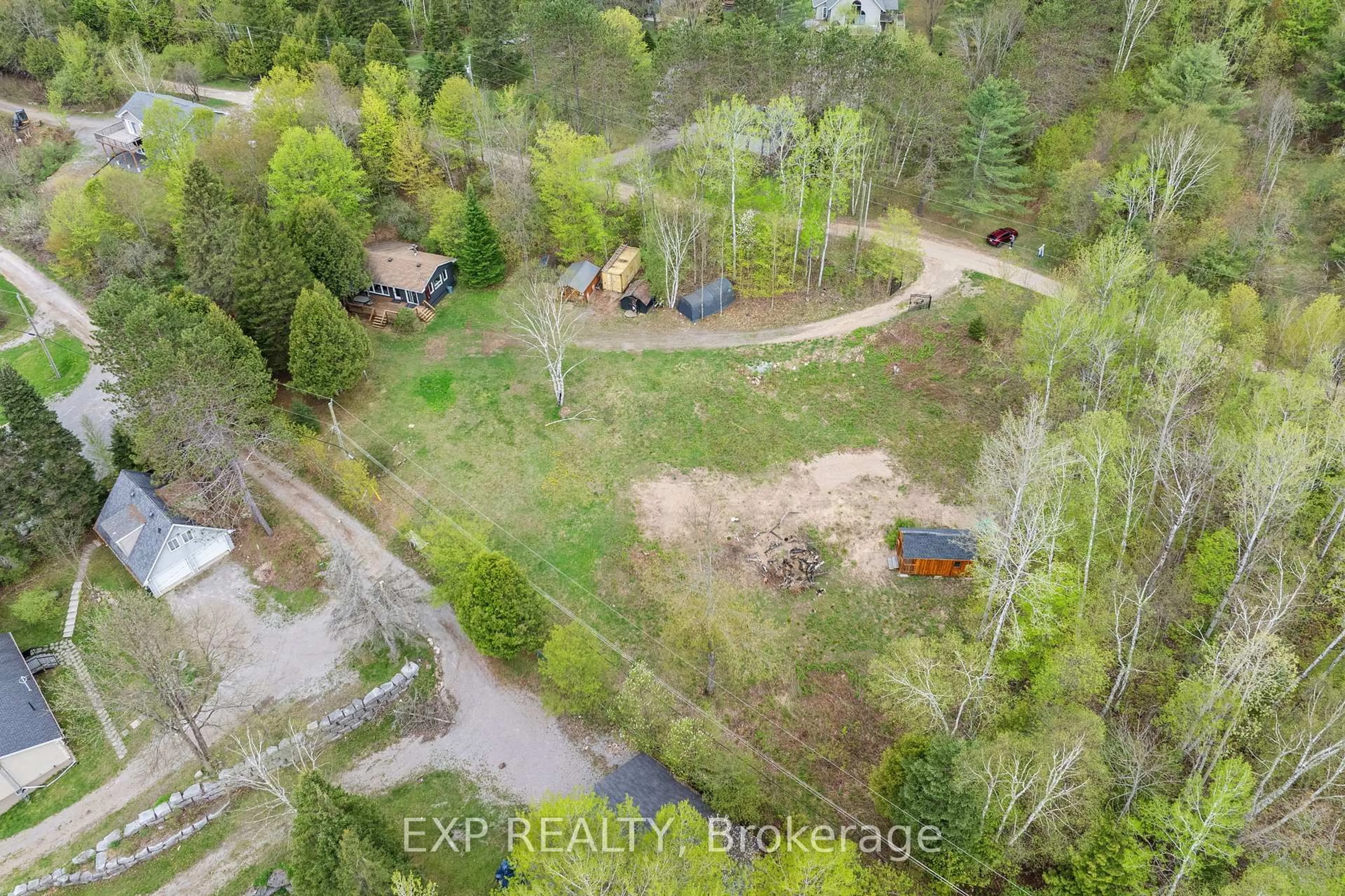 A pic from outside/outdoor area/front of a property/back of a property/a pic from drone, forest/trees view for 1044 Shanahan Tr, Minden Hills Ontario K0M 2K0