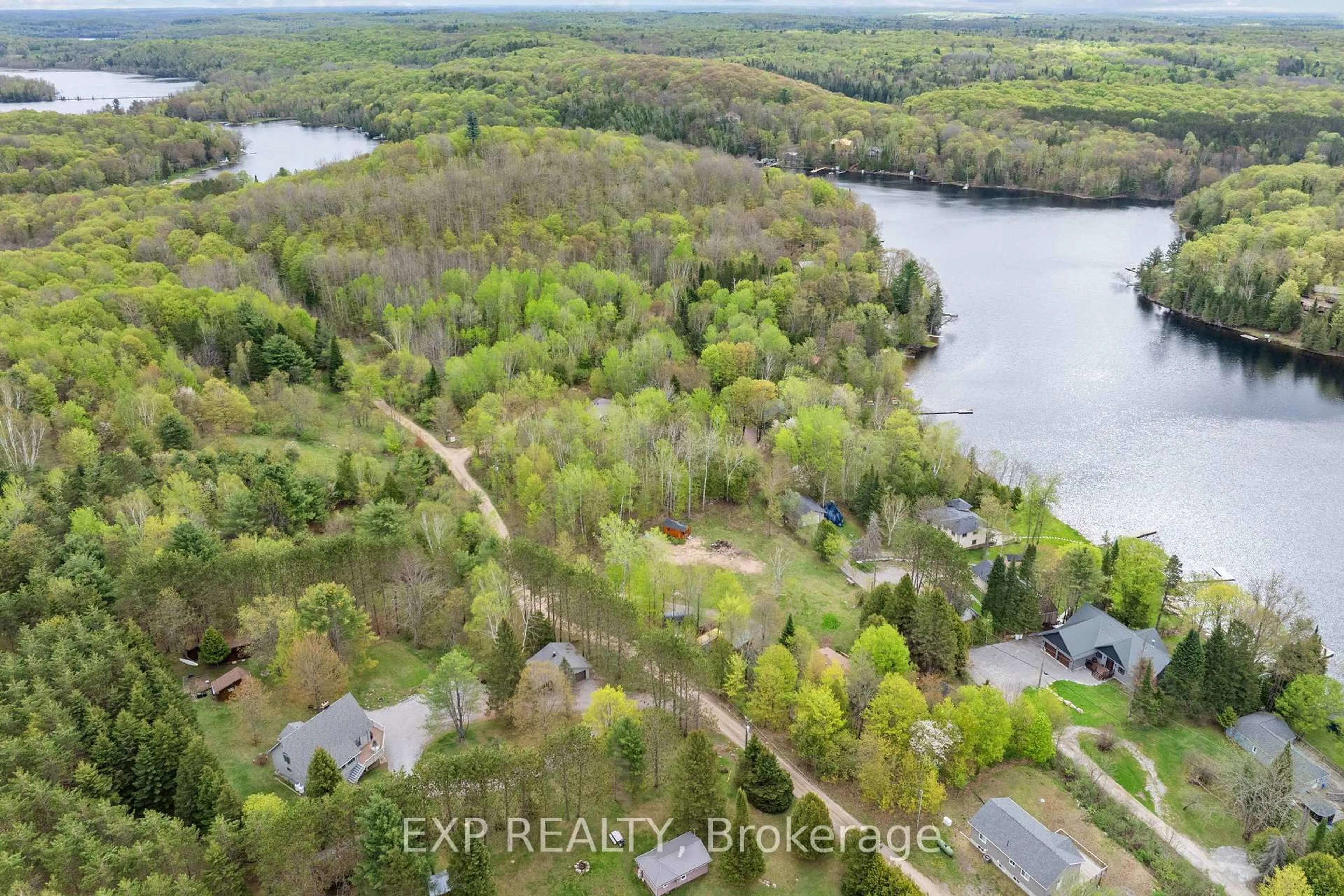 A pic from outside/outdoor area/front of a property/back of a property/a pic from drone, water/lake/river/ocean view for 1044 Shanahan Tr, Minden Hills Ontario K0M 2K0