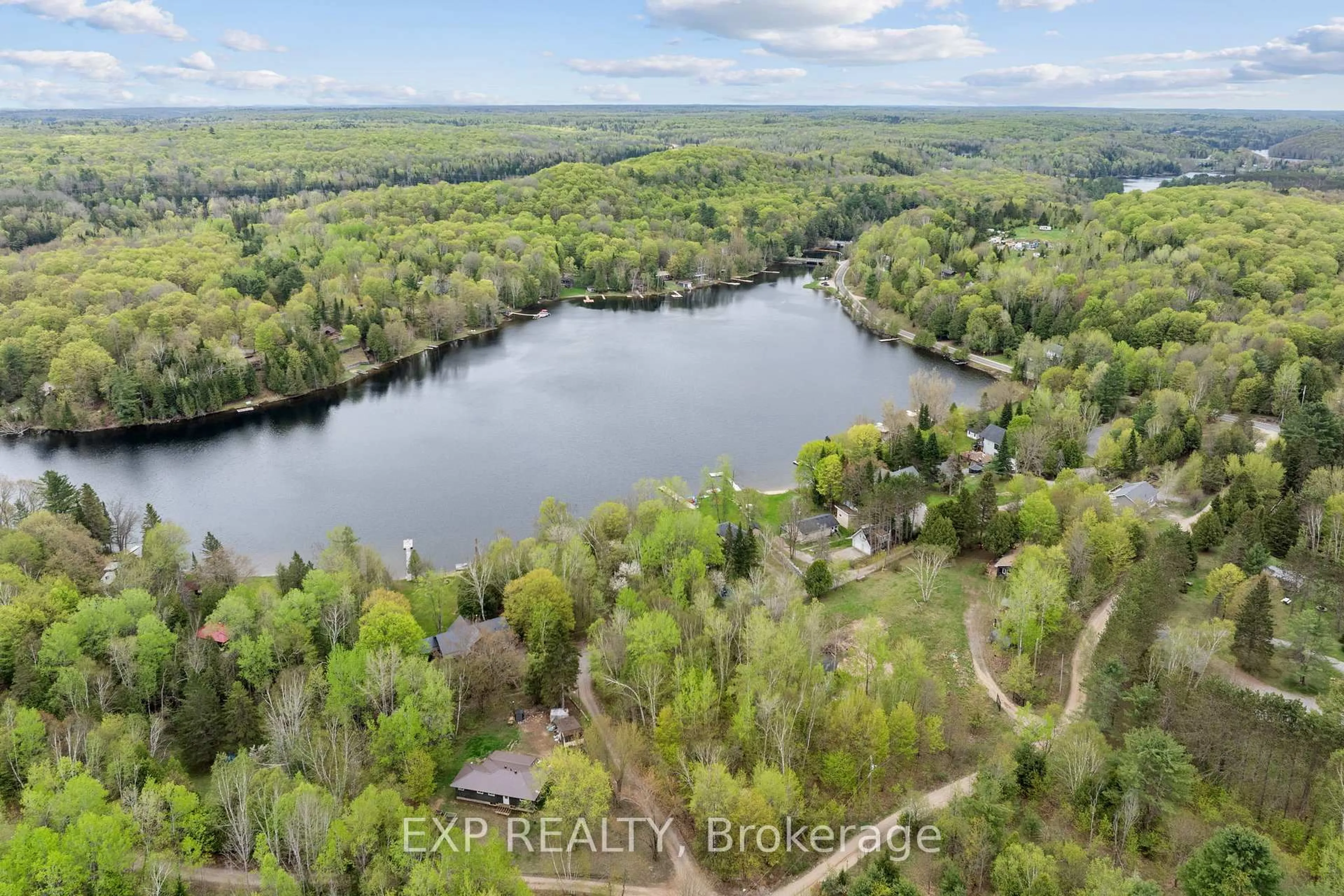 A pic from outside/outdoor area/front of a property/back of a property/a pic from drone, water/lake/river/ocean view for 1044 Shanahan Tr, Minden Hills Ontario K0M 2K0