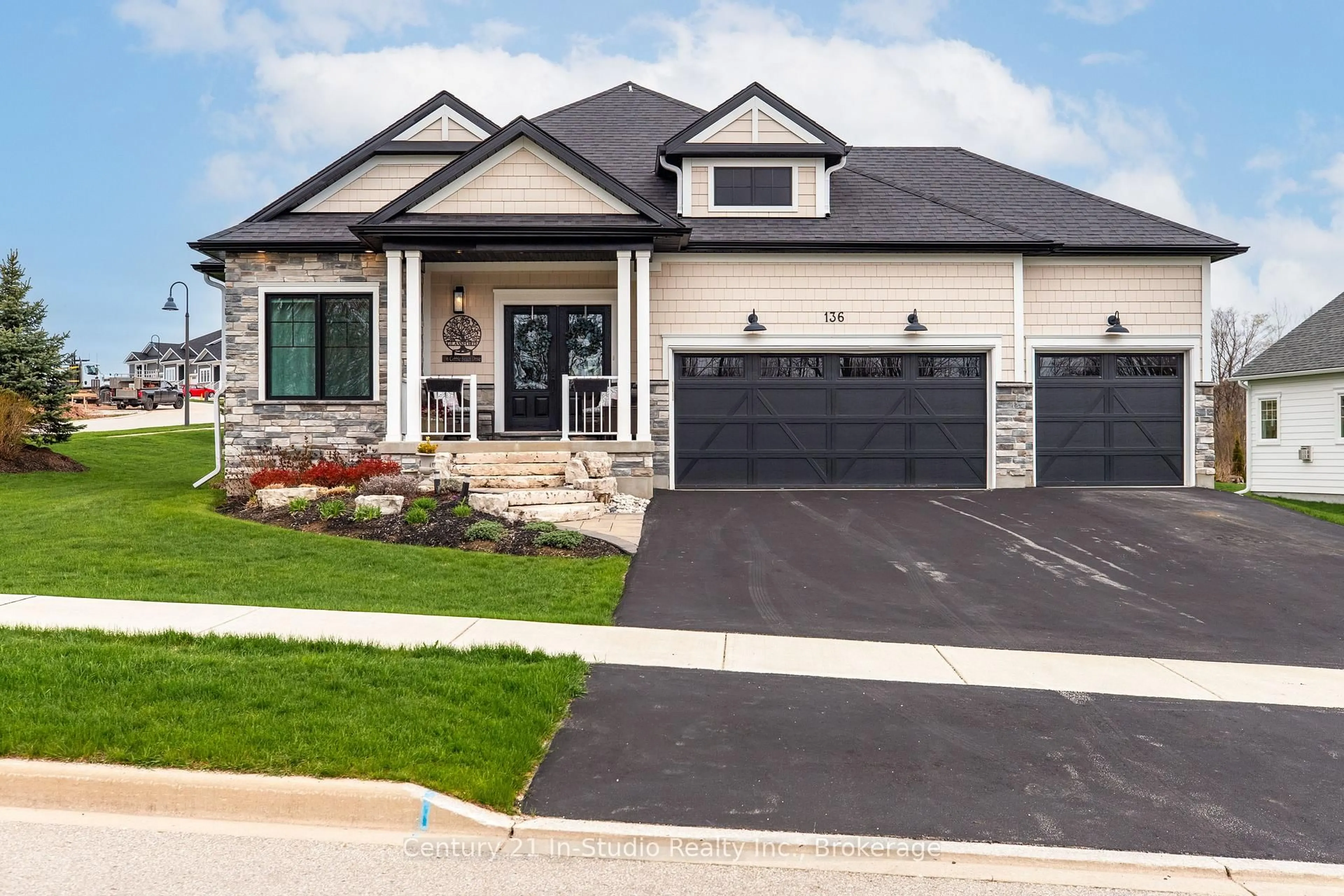 Home with brick exterior material, street for 136 Cobble Beach Dr, Georgian Bluffs Ontario N0H 1S0