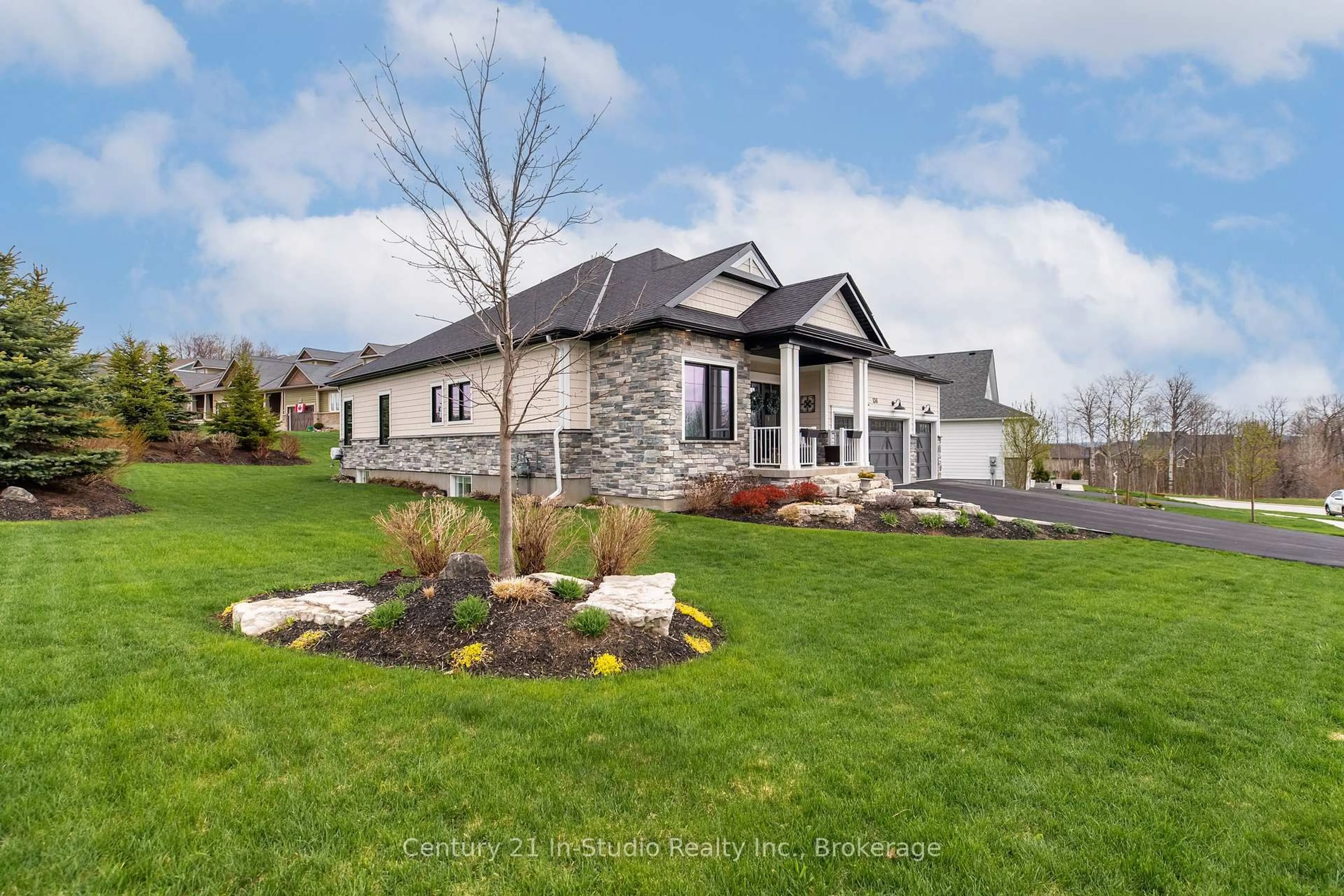 Home with brick exterior material, street for 136 Cobble Beach Dr, Georgian Bluffs Ontario N0H 1S0