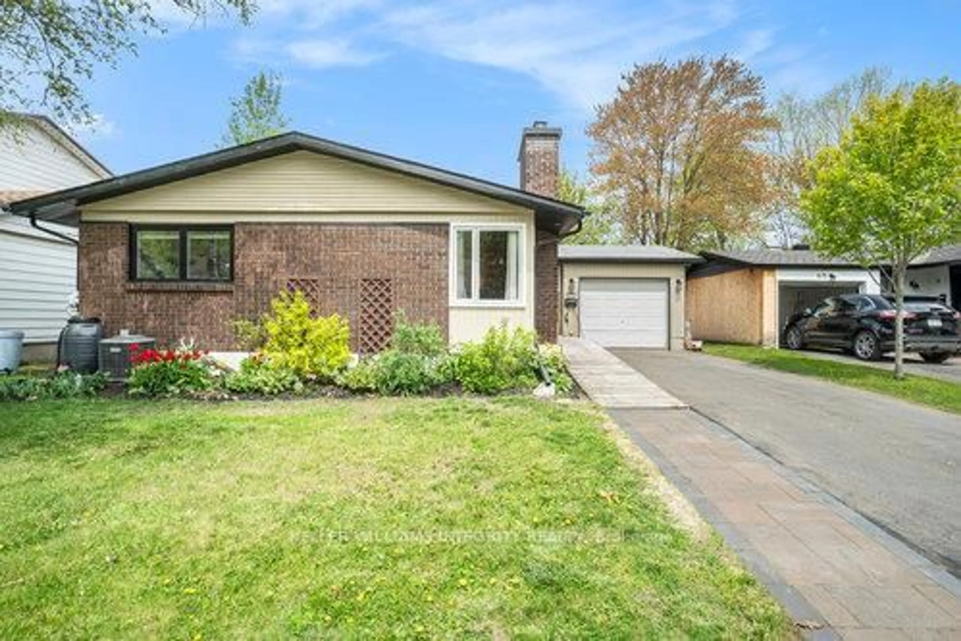 Home with brick exterior material, street for 673 La Verendrye Dr, Gloucester Ontario K1J 7X5