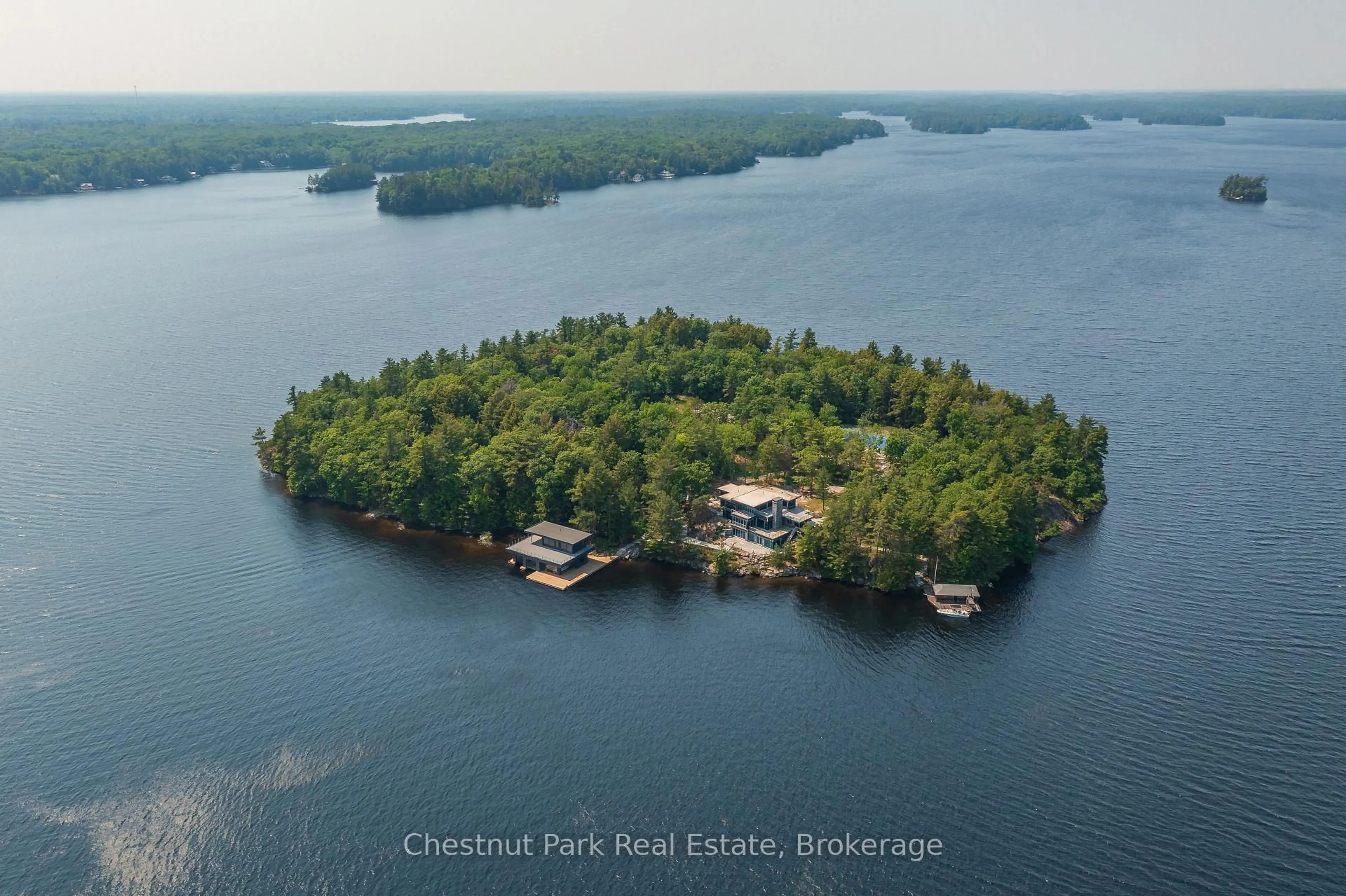 A pic from outside/outdoor area/front of a property/back of a property/a pic from drone, water/lake/river/ocean view for 1 BASS, Muskoka Lakes Ontario P0B 1A0