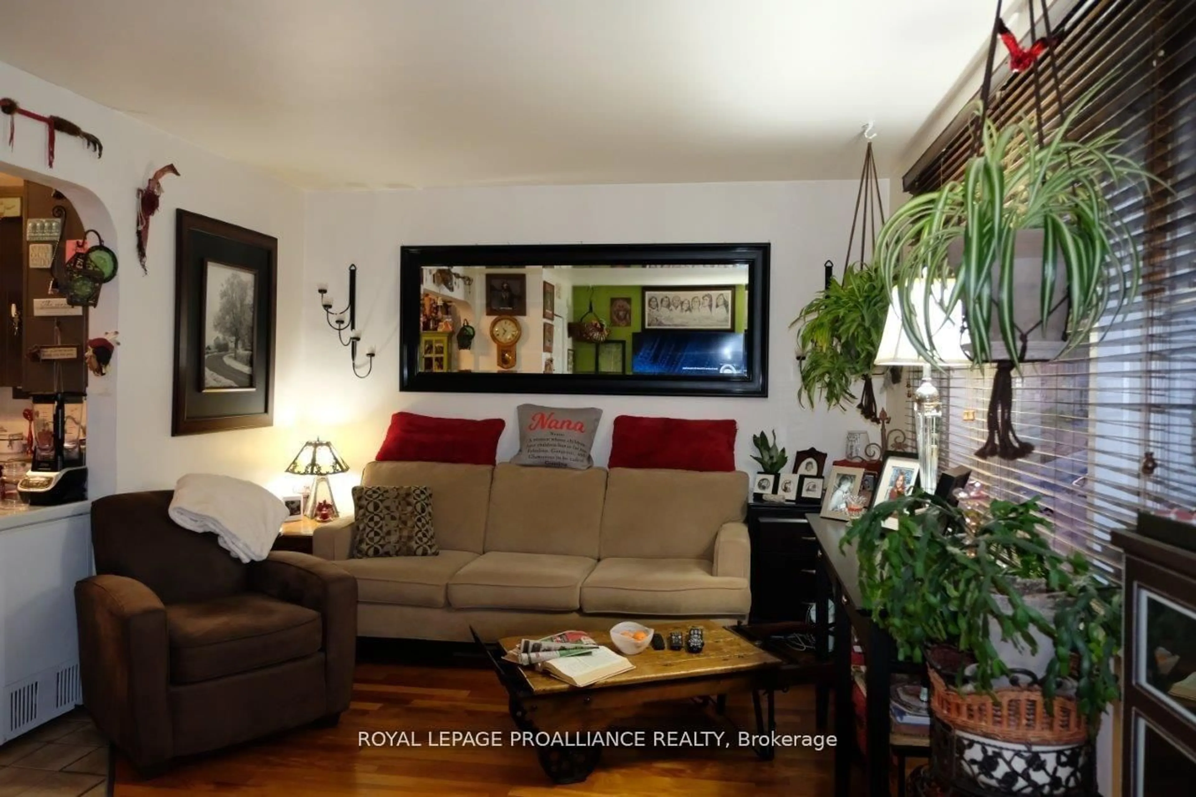 Living room with furniture, wood/laminate floor for 527 Front St, Quinte West Ontario K8V 4R4