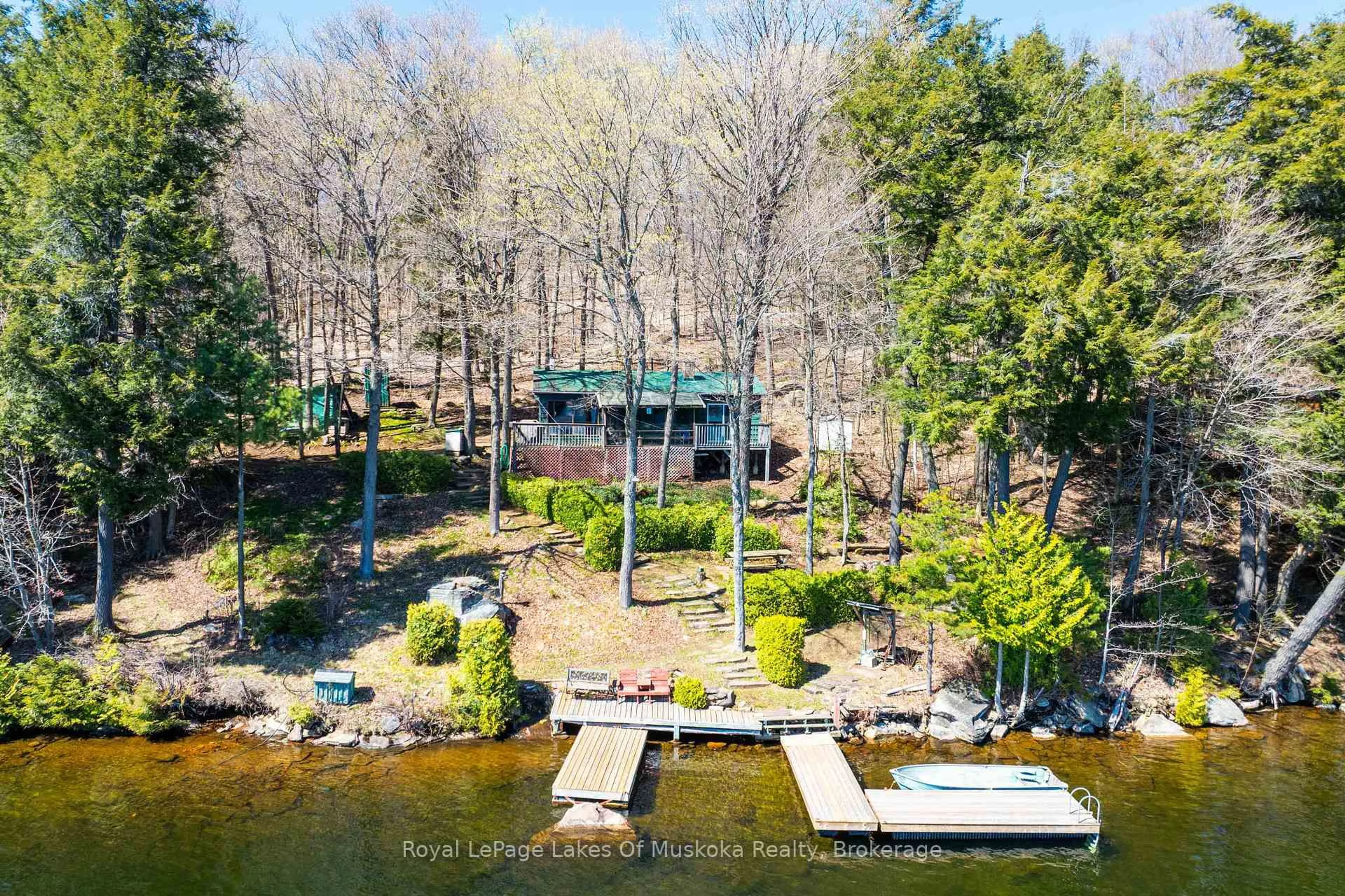 A pic from outside/outdoor area/front of a property/back of a property/a pic from drone, water/lake/river/ocean view for 1002 Camp Lake Rd, Lake of Bays Ontario P1H 2J6