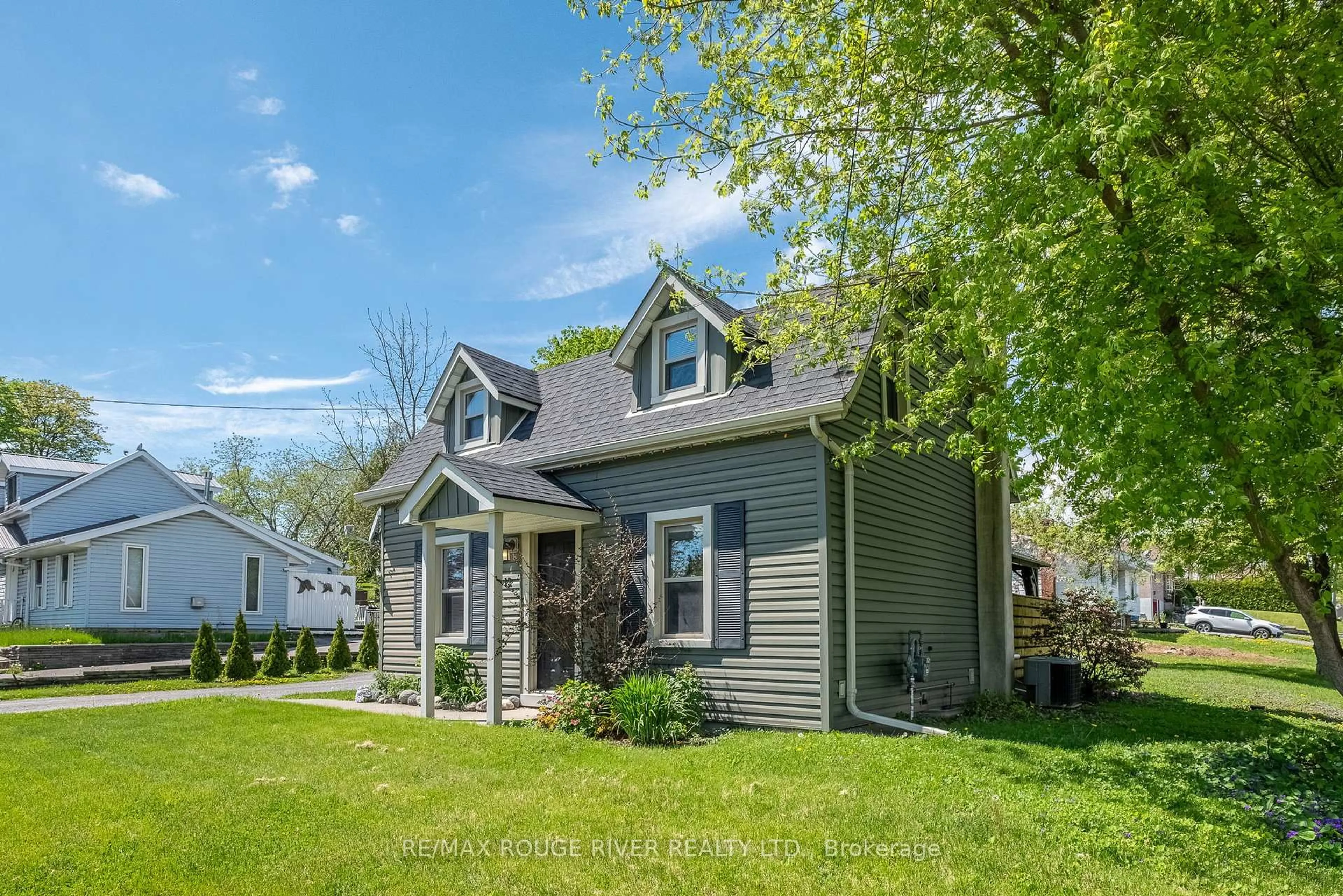 Home with vinyl exterior material, street for 12 Singleton St, Brighton Ontario K0K 1H0