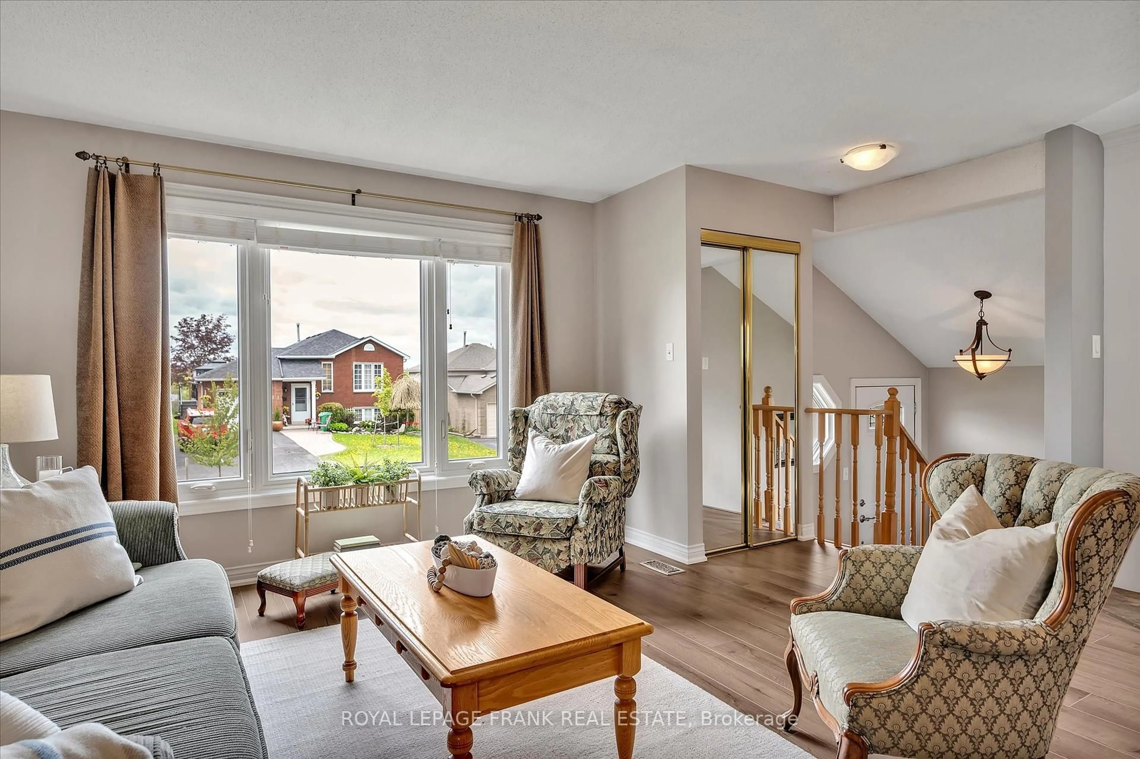 Living room with furniture, wood/laminate floor for 2114 Easthill Dr, Peterborough East Ontario K9L 1Y8